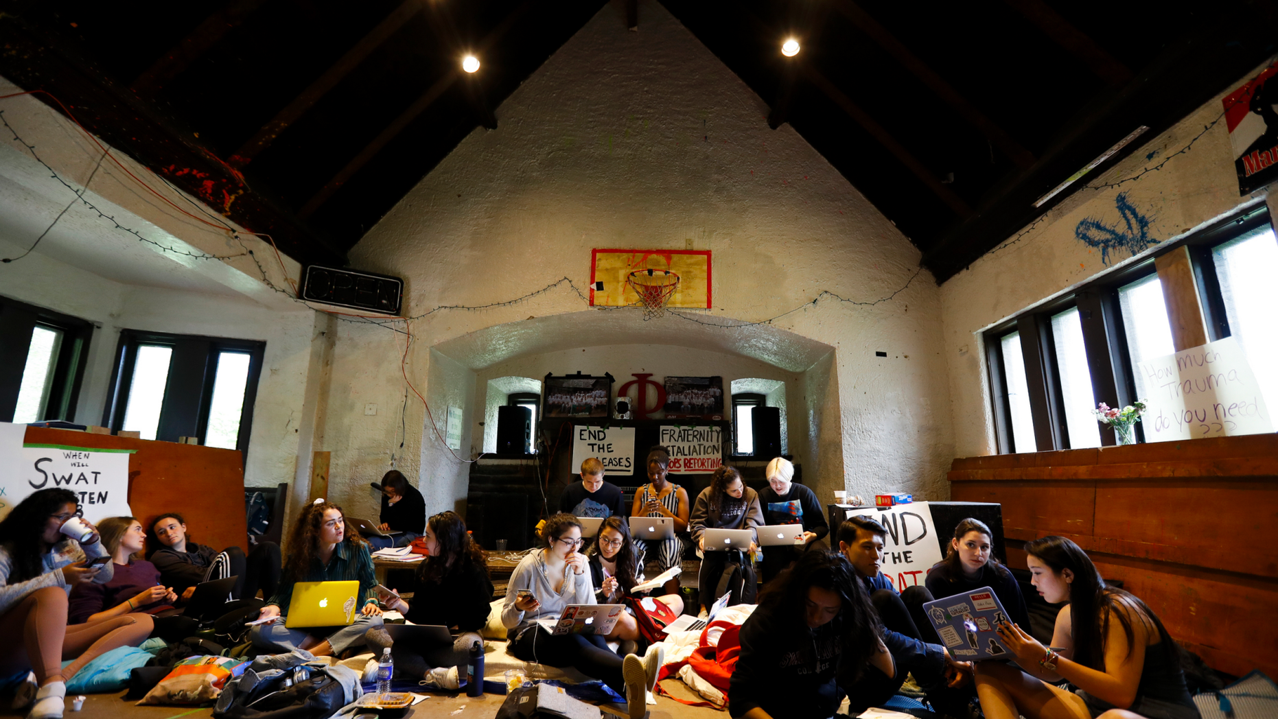 Swarthmore College students gather at the Phi Psi fraternity house during a sit-in, Monday, April 29, 2019, in Swarthmore, Pa. Students at the suburban Philadelphia college have occupied the on-campus fraternity house in an effort to get it shut down after documents allegedly belonging to Phi Psi surfaced this month containing derogatory comments about women and the LGBTQ community and jokes about sexual assault. (AP Photo)