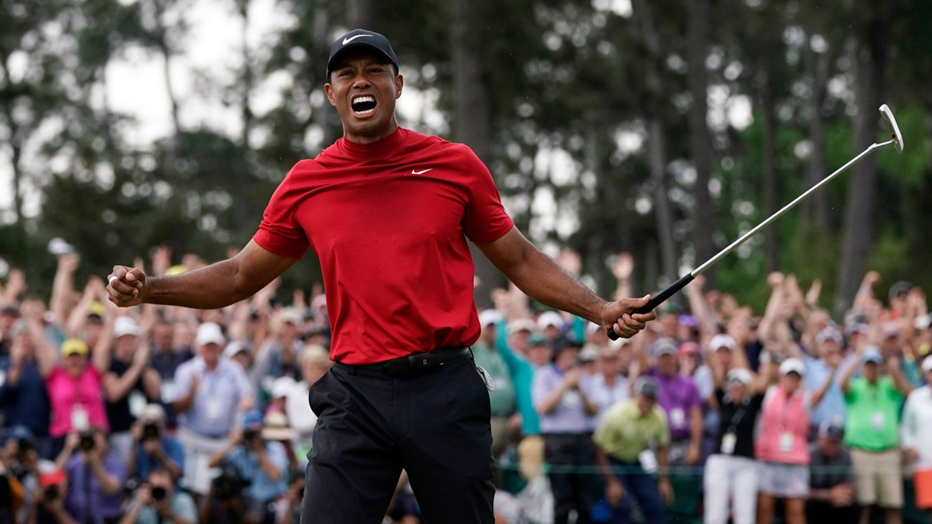 Tiger Woods reacts while he wins the Masters golf tournament on Sunday, April 14, 2019 in Augusta, Georgia (AP Photo / David J. Phillip)