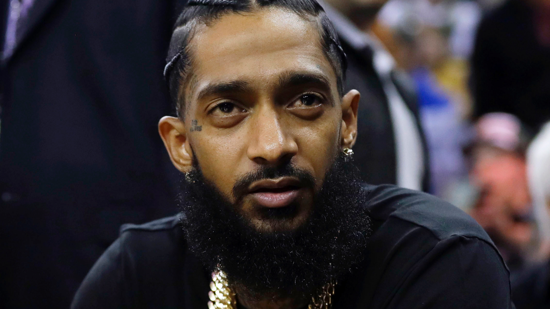 Rapper Nipsey Hussle at an NBA basketball game between the Golden State Warriors and the Milwaukee Bucks in Oakland, Calif. Hussle was shot and killed on March 31, 2019 outside of his clothing store in Los Angeles.