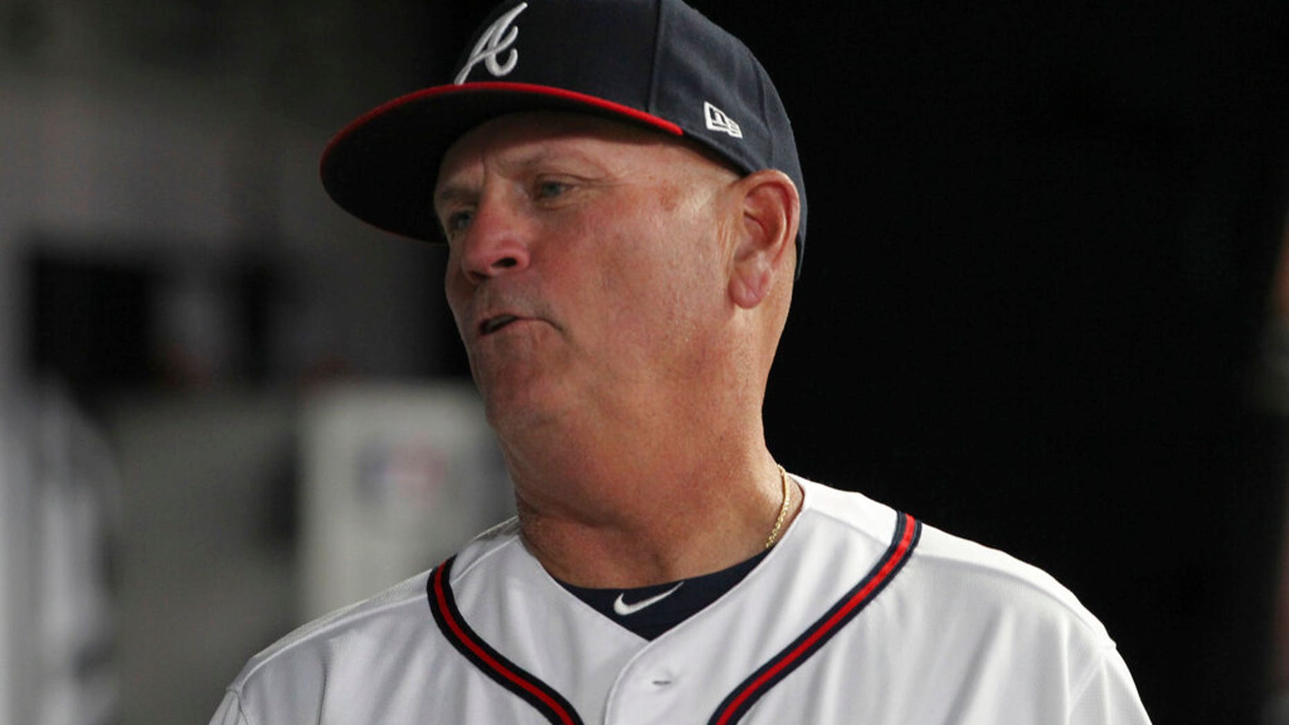Atlanta Braves manager Brian Snitker talks to players in the dugout during the seventh inning of the team's baseball game against the New York Mets on Saturday, April 13, 2019, in Atlanta. (AP Photo/Tami Chappell)