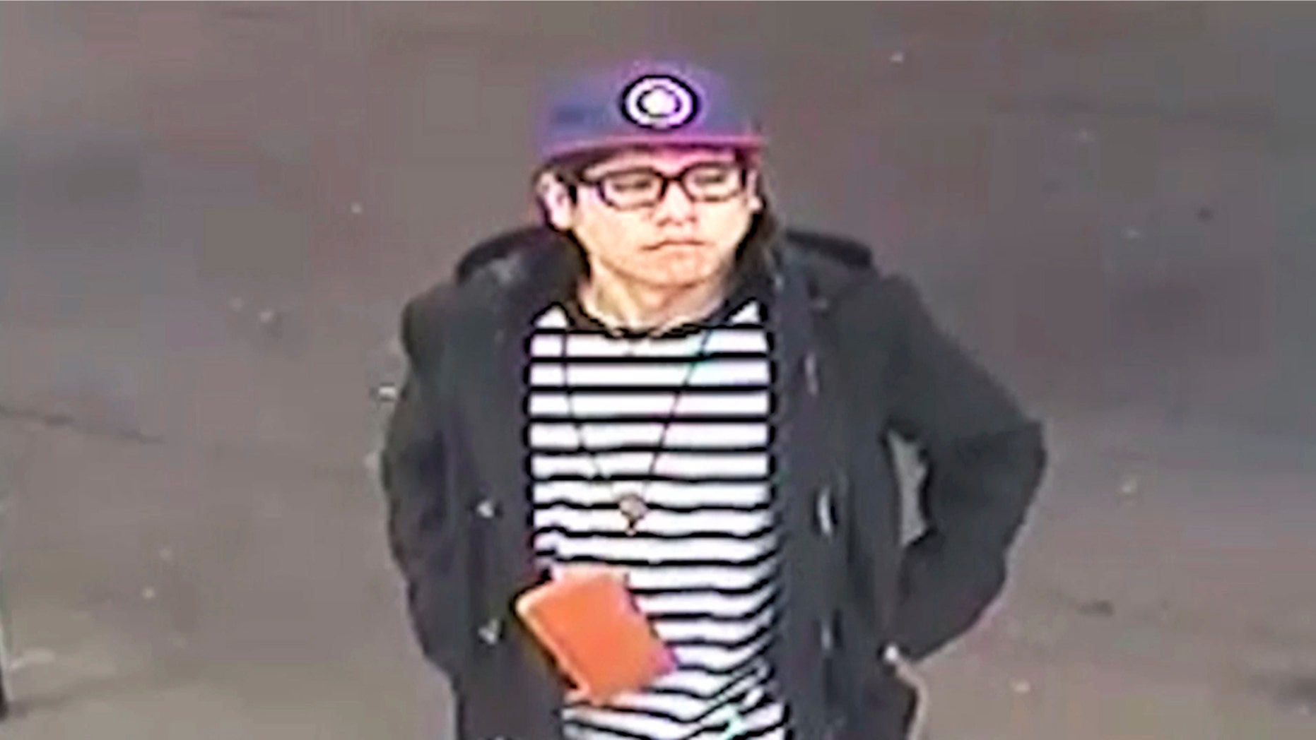 This May 25, 2018 image from surveillance video released by the New South Wales Police Force shows victim Wachira "Mario" Phetmang, 33, entering a service station in South Hurstville, a suburb of Sydney. Authorities have identified an American suspect in the killing of Phetmang, April 9. 2019.