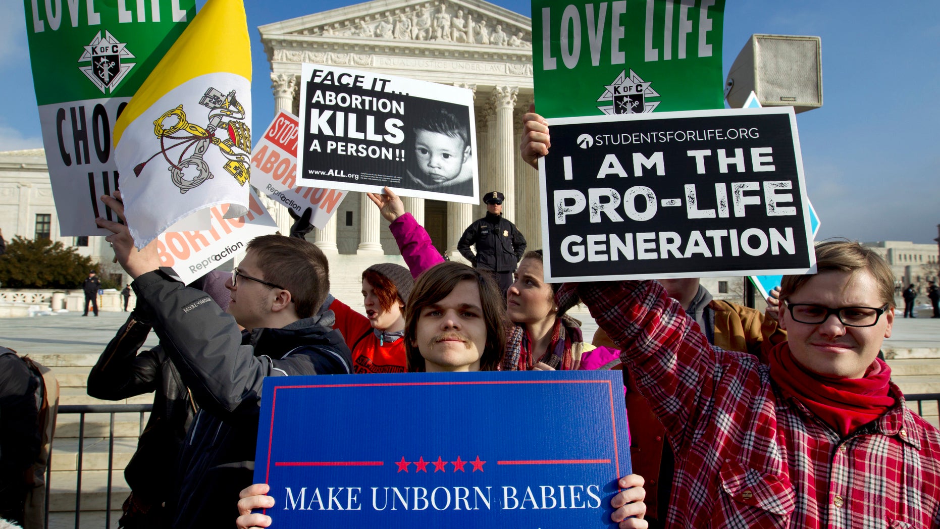 FILE - In this Jan. 18, 2019, file photo, anti-abortion activists protest outside of the U.S. Supreme Court during the March for Life in Washington. A committee in Texas considered a bill this week that would have opened the door to put women to death for their abortions.