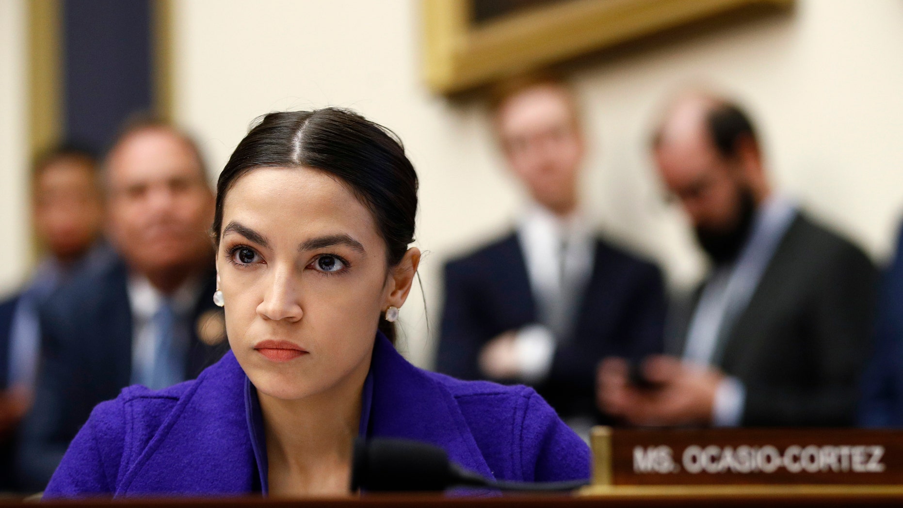 Rep. Alexandria Ocasio-Cortez, D-N.Y., Listening to a Hearing of the House Financial Services Committee with the Leaders of the Capitol's Leading Banks in Washington. (Associated Press)