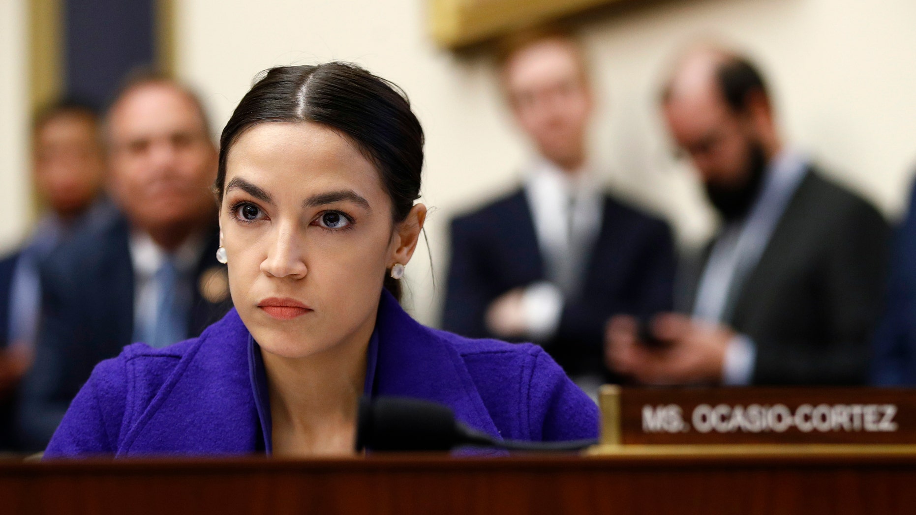 Rep. Alexandria Ocasio-Cortez, D-N.Y., listens during a House Financial Services Committee hearing with leaders of major banks on Capitol Hill in Washington. (AP Photo/Patrick Semansky, File)