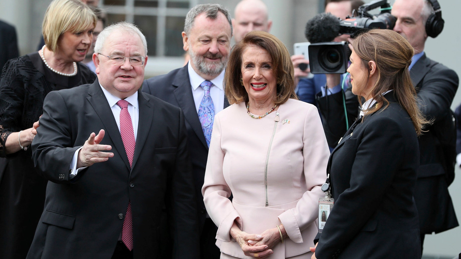 US House of Representatives speaker Nancy Pelosi is greeted by Chairperson of the lower house of parliament Sean O Fearghail, left, on arrival at Leinster House in Dublin to deliver an address in Dublin, Ireland, Wednesday April 17, 2019. (Brian Lawless, via AP)