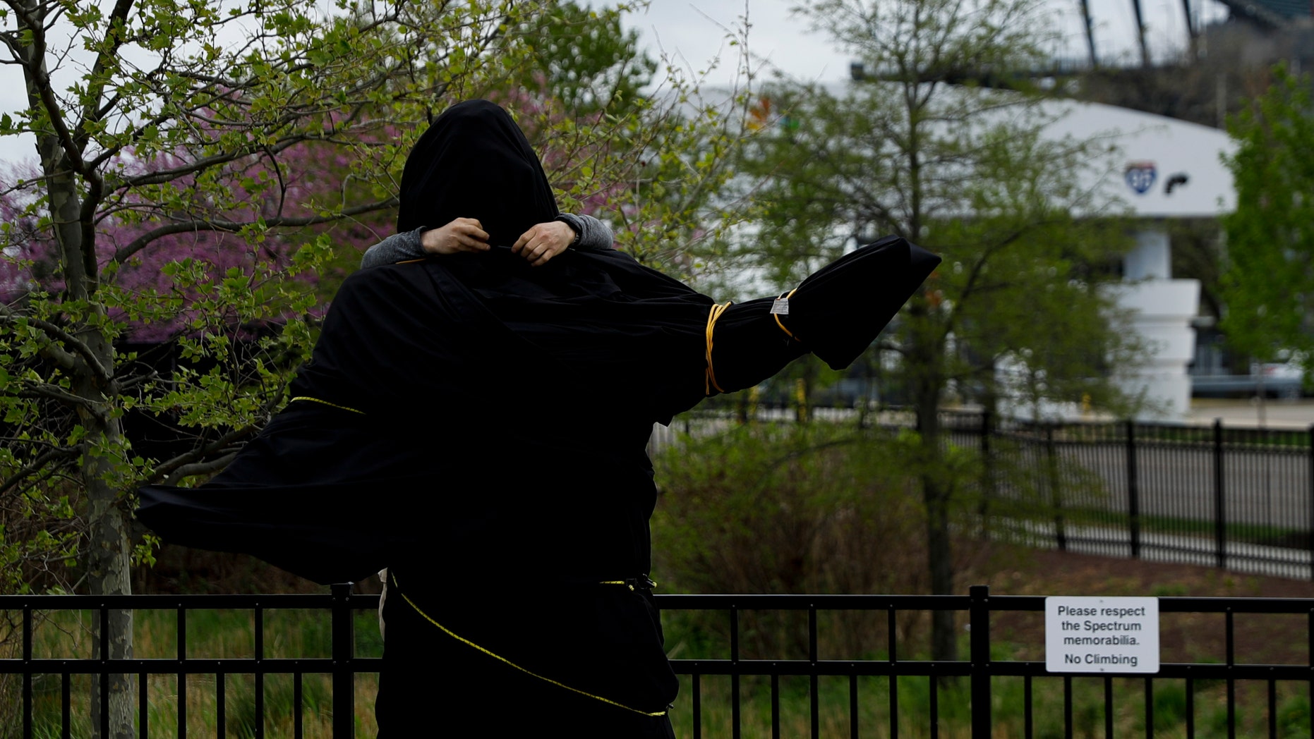 A worker covers a statue of the late singer Kate Smith near the Wells Fargo Center, Friday, April 19, 2019, in Philadelphia. (Associated Press)