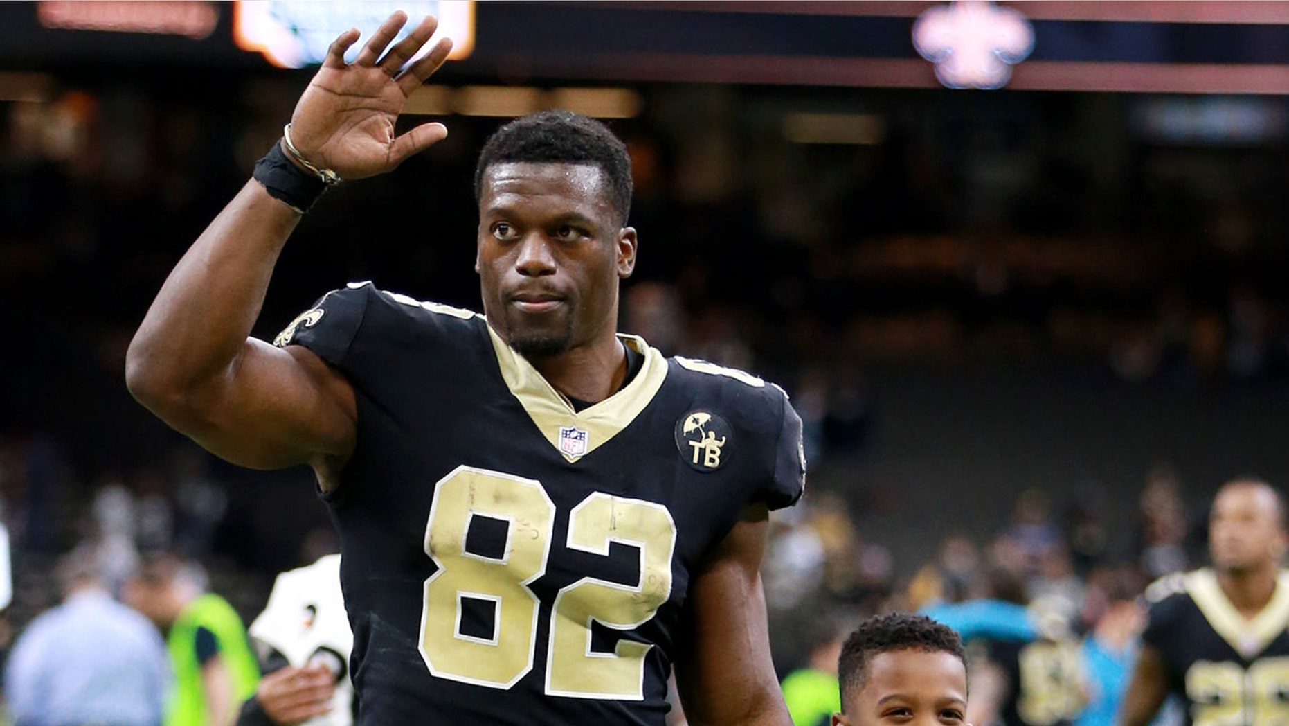 Benjamin Watson, number 82 of the New Orleans Saints, leaves the field with his son after the NFL game against the Carolina Panthers at the Mercedes-Benz Superdome in New Orleans, Louisiana on December 30, 2018. (Photo by Sean Gardner / Getty Images)