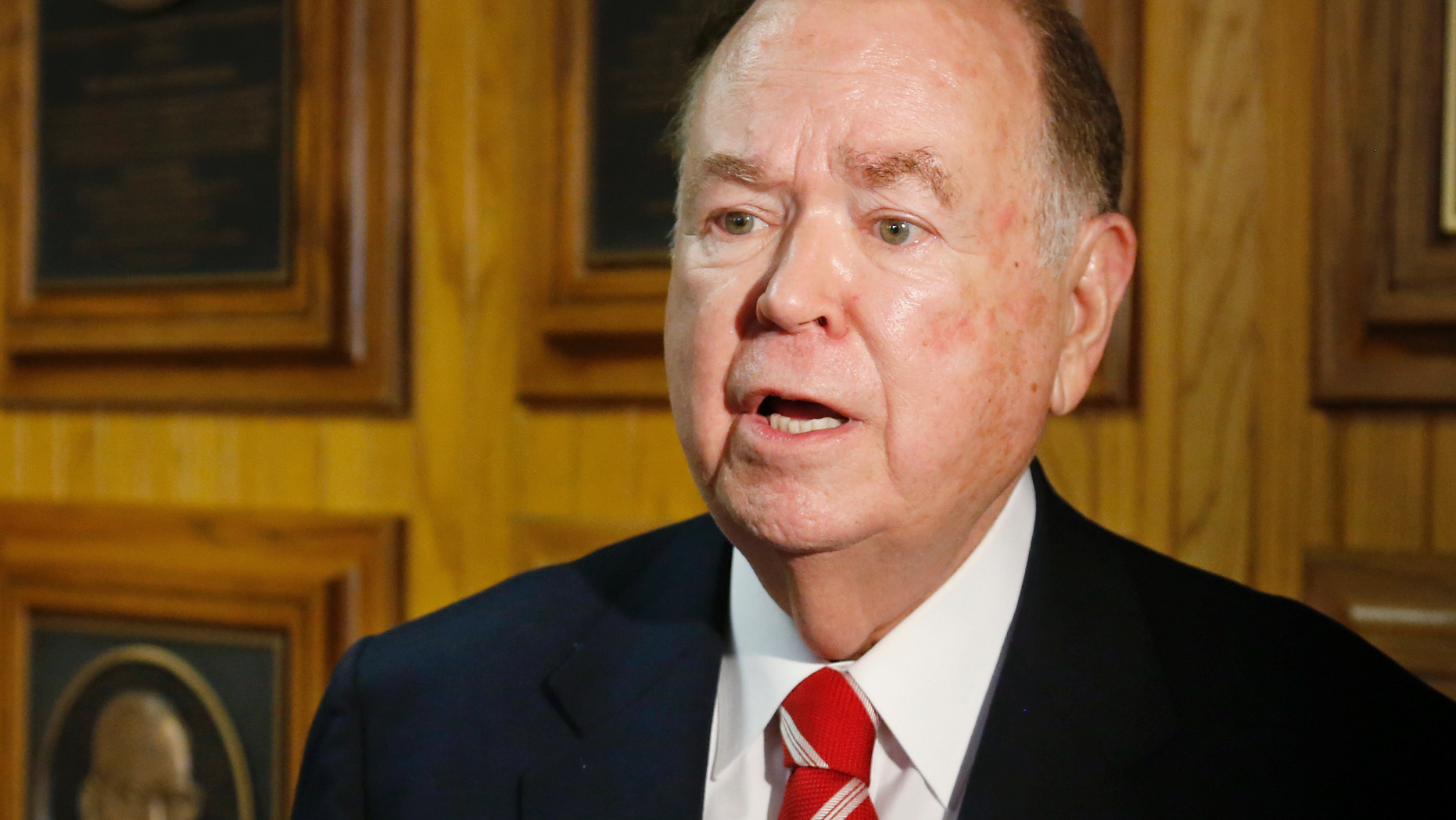 FILE - In this March 10, 2015 file photo, University of Oklahoma President David Boren talks with the media before the start of a Board of Regents meeting in Oklahoma City. The attorney for Boren says Boren has met with investigators looking into allegations he sexually harassed male subordinates. Attorney Clark Brewster told The Oklahoman that Boren met Friday, April 5, 2019 with investigators and answered all of their questions, but Brewster declined to discuss specific questions. (AP Photo/Sue Ogrocki, File)