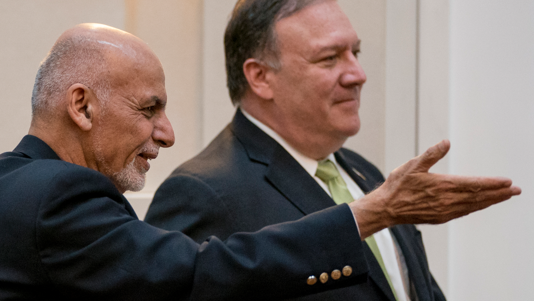 FILE - In this July 9, 2018 file photo, Afghan President Ashraf Ghani, left, and Secretary of State Mike Pompeo, arrive for a news conference in Kabul, Afghanistan. U.S. Secretary of State Mike Pompeo called the Afghan president over the weekend to express disappointment over the indefinite postponement of talks with the Taliban and to condemn the insurgent's latest "spring offensive." The Afghan-to-Afghan talks in Qatar were scheduled to start Friday, April 19, 2019, when they were scuttled after a falling out over who should attend. (AP Photo/Andrew Harnik, Pool, File)