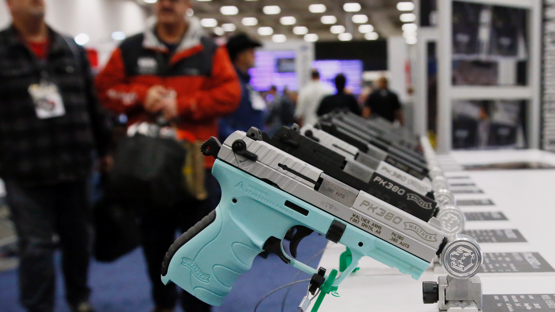 FILE - In this May 4, 2018, file photo, handguns are on display at the NRA convention in Dallas. The National Rifle Association is gathering for its 148th annual meeting beginning Thursday, April 25, 2019, in Indianapolis. (AP Photo/Sue Ogrocki, File)