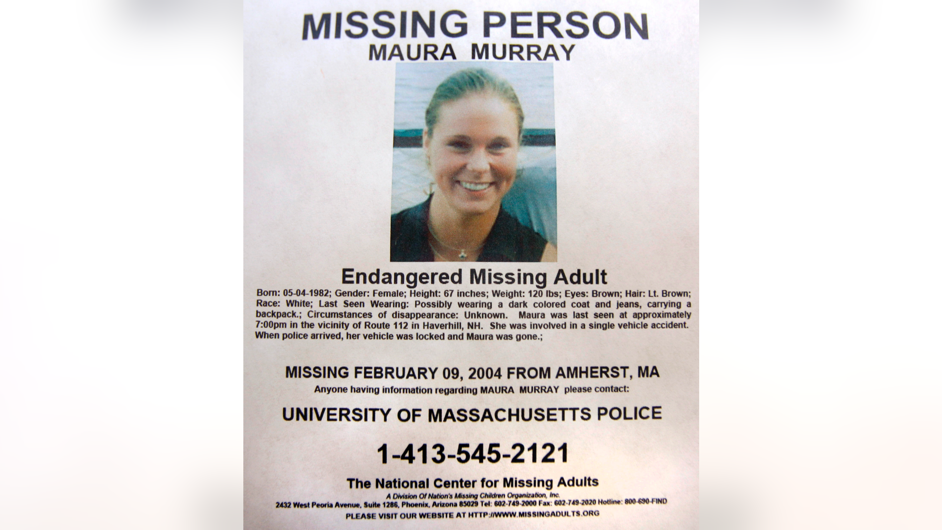 FILE - This Feb. 4, 2014 photo shows a missing person poster of Maura Murray that hangs in the lobby of the police station in Haverhill, N.H. Authorities are in an area of the northern New Hampshire town on Wednesday, April 3, 2019, related to an ongoing investigation into her disappearance in 2004. (AP Photo/Jim Cole, File)