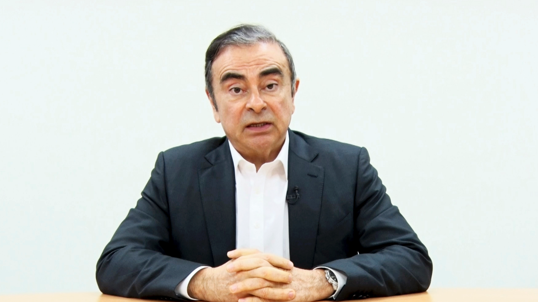 In this image made from video released by Carlos Ghosn via his lawyer Tuesday, April 9, 2019, former Nissan chairman Ghosn speaks on camera in Tokyo. Ghosn, who was arrested in Japan on financial misconduct charges, gets his say in a video shown by his legal team. (Carlos Ghosn via AP)