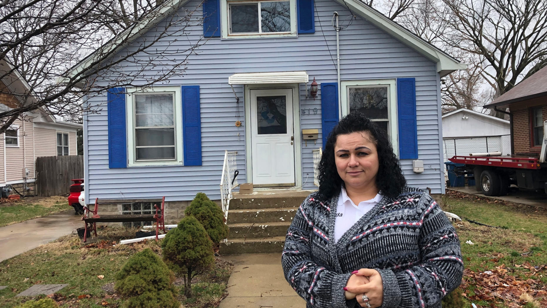 Linda Ramirez stands in front of her house in Aurora, Ill., Thursday, April 4, 2019, where she is waiting to learn if a 14-year-old who told police he is Timmothy Pitzen and had escaped kidnappers in the Cincinnati area is really him. Authorities conducted DNA testing to try to determine Thursday whether a teenager found wandering the streets of a Kentucky town is who he claims to be — an Illinois boy who disappeared eight years ago around the time his mother took her own life. (AP Photo/Carrie Antlfinger)
