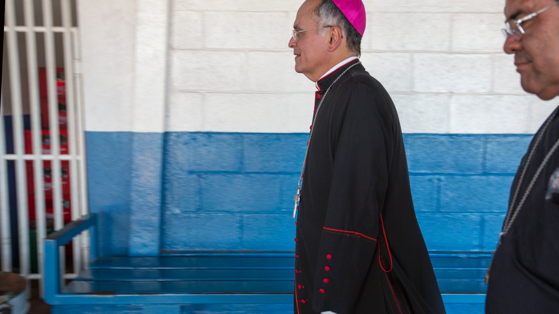 FILE - In this May 6, 2018 file photo, Managua's auxiliary Roman Catholic Bishop Silvio Báez arrives at the Sacred Heart church in Managua, Nicaragua. Báez, an outspoken critic of Nicaraguan President Daniel Ortega has left on Tuesday, April 23, 2019, for the Vatican after being called there indefinitely by Pope Francis. (AP Photo/Moises Castillo, File)