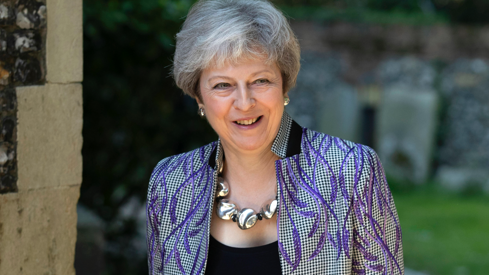 Britain's Prime Minister Theresa May arrives with her husband Philip to attend an Easter Sunday church service near her Maidenhead constituency, south England, Sunday April 21, 2019. (Steve Parsons/PA via AP)