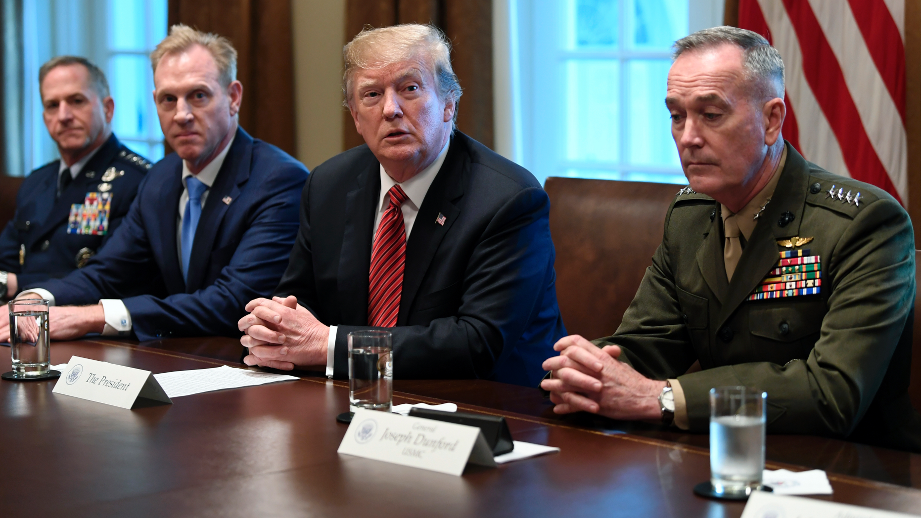 President Donald Trump, second from right, flanked by acting Defense Secretary Patrick Shanahan, second from left, and Chairman of the Joint Chiefs of Staff Gen. Joseph Dunford, right, speaks during a meeting with military leaders in the Cabinet Room of the White House in Washington, Wednesday, April 3, 2019. At left is Air Force Chief of Staff Gen. David Goldfein. (AP Photo/Susan Walsh)