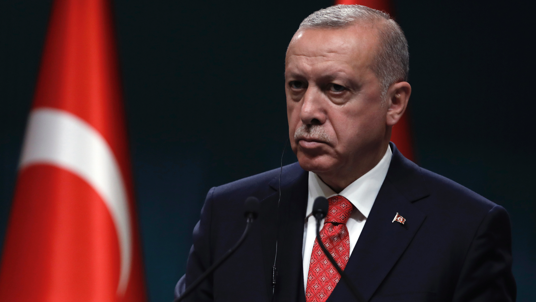 Turkey's President Recep Tayyip Erdogan listens during a joint press conference with Bolivian President Evo Morales after their talks at the presidential palace in Ankara, Turkey, Tuesday, April 9, 2019. Morales is in Turkey on a two-day state visit. (AP Photo/Burhan Ozbilici)