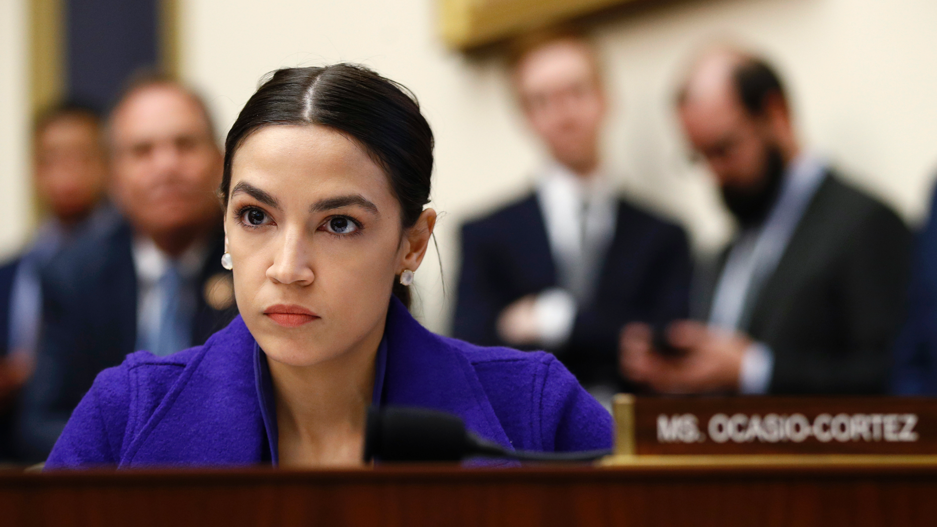 FILE - In this Wednesday, April 10, 2019, file photo, Rep. Alexandria Ocasio-Cortez, D-N.Y., listens during a House Financial Services Committee hearing with leaders of major banks on Capitol Hill in Washington.