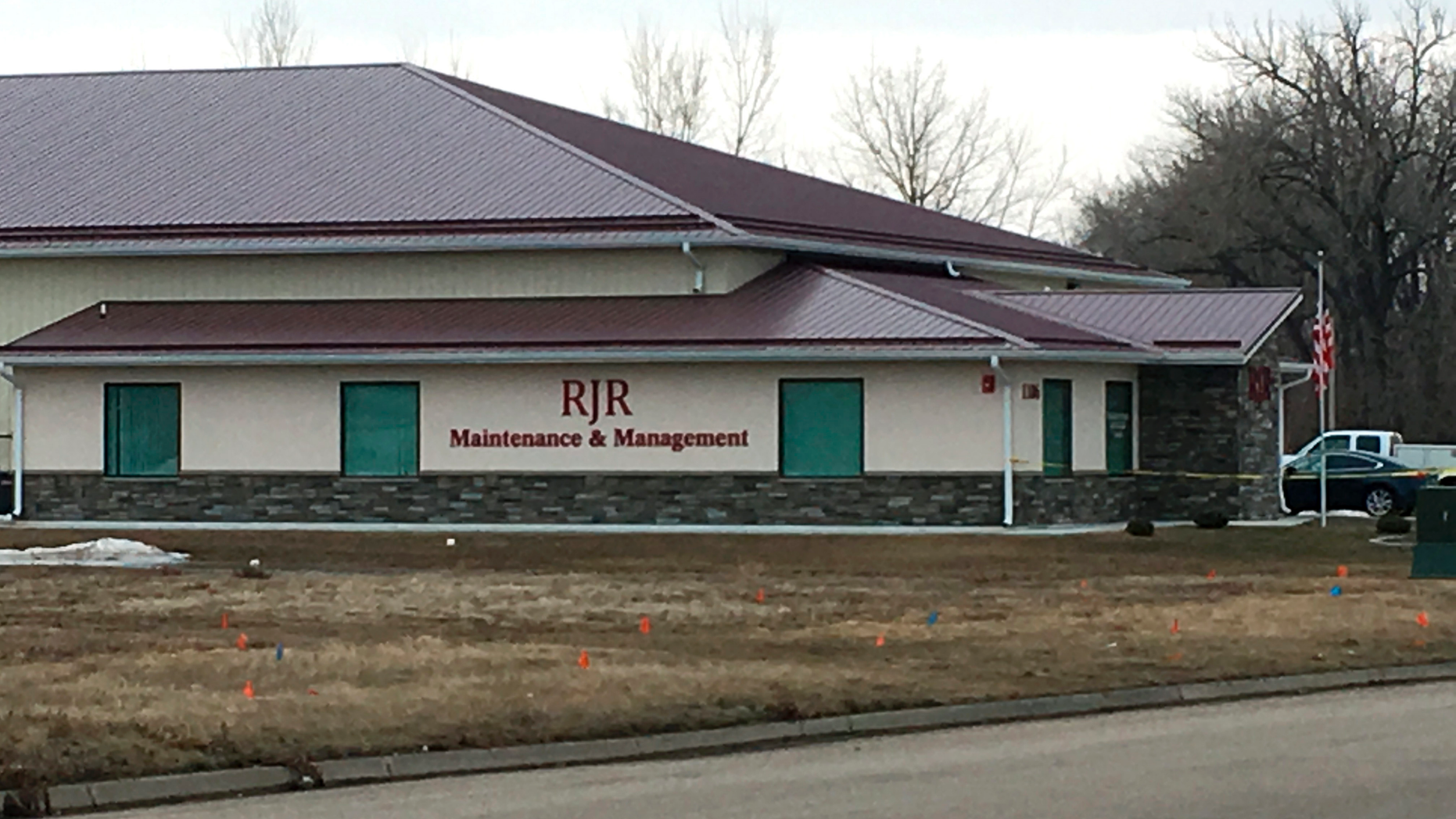 Cars are parked outside RJR Maintenance and Management in Mandan, ND, on Monday, April 1, 2019. Police in North Dakota declare 