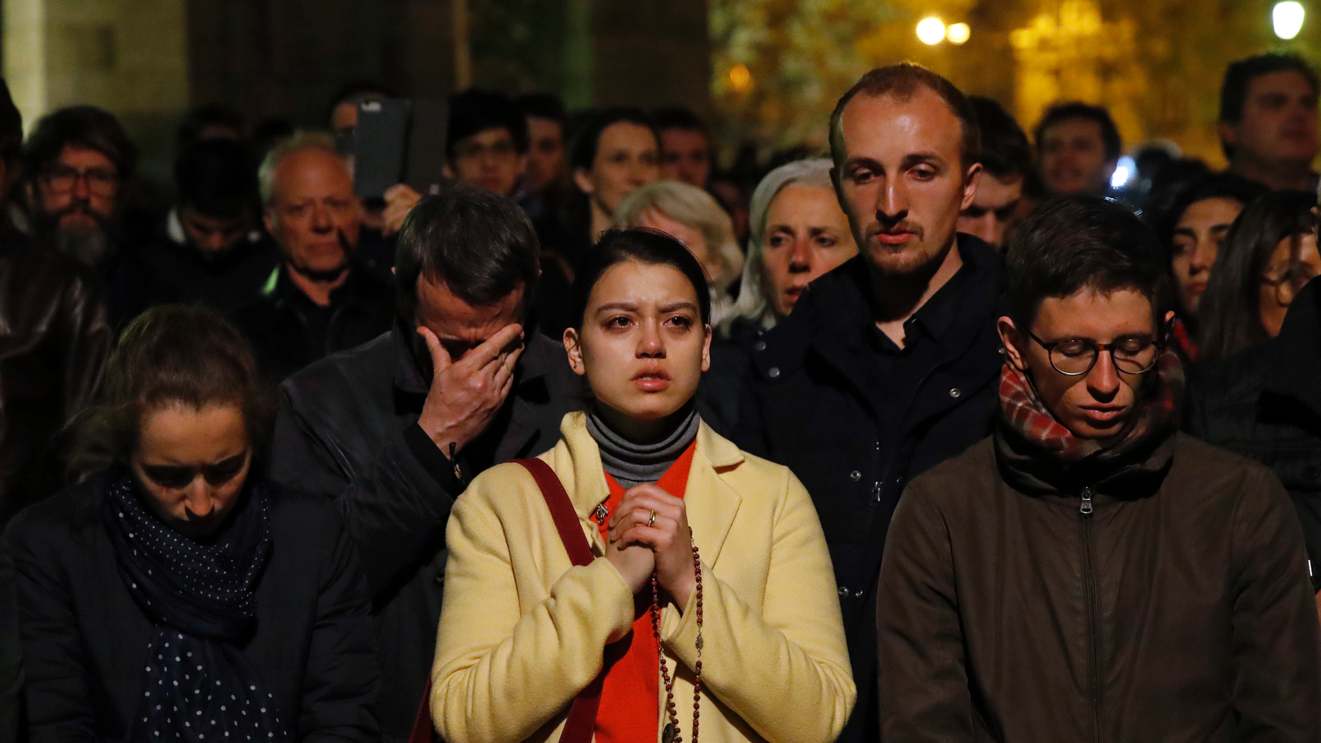 Image result for notre dame cathedral people pray