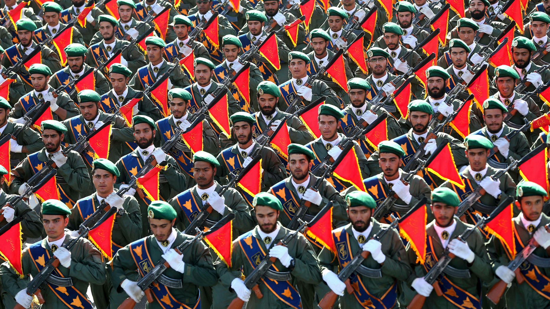 FILE - In this Sept. 21, 2016 file photo, Iran's Revolutionary Guard troops march in a military parade marking the 36th anniversary of Iraq's 1980 invasion of Iran, in front of the shrine of late revolutionary founder Ayatollah Khomeini, just outside Tehran, Iran. The Trump administration is preparing to designate Iran’s Revolutionary Guards Corps a “foreign terrorist organization” in an unprecedented move that could have widespread implications for U.S. personnel and policy. U.S. Officials say an announcement could come as early as Monday, April 8, 2019, following a months-long escalation in the administration’s rhetoric against Iran. The move would be the first such designation by any U.S. administration of an entire foreign government entity. (AP Photo/Ebrahim Noroozi, File)