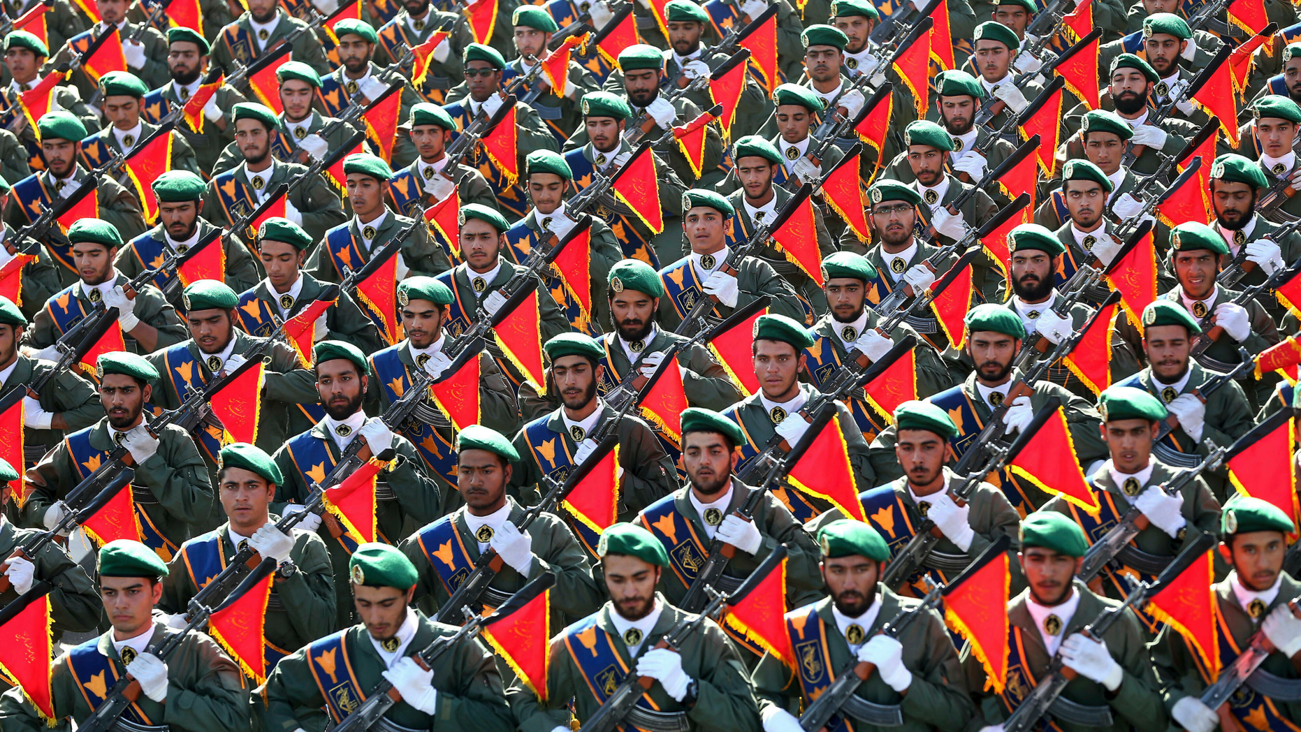 FILE - In this Sept. 21, 2016 file photo, Iran's Revolutionary Guard troops march in a military parade marking the 36th anniversary of Iraq's 1980 invasion of Iran, in front of the shrine of late revolutionary founder Ayatollah Khomeini, just outside Tehran, Iran. The Trump administration is preparing to designate Iran’s Revolutionary Guards Corps a “foreign terrorist organization” in an unprecedented move that could have widespread implications for U.S. personnel and policy. U.S. Officials say an announcement could come as early as Monday, April 8, 2019, following a months-long escalation in the administration’s rhetoric against Iran. The move would be the first such designation by any U.S. administration of an entire foreign government entity. (AP Photo/Ebrahim Noroozi, File)