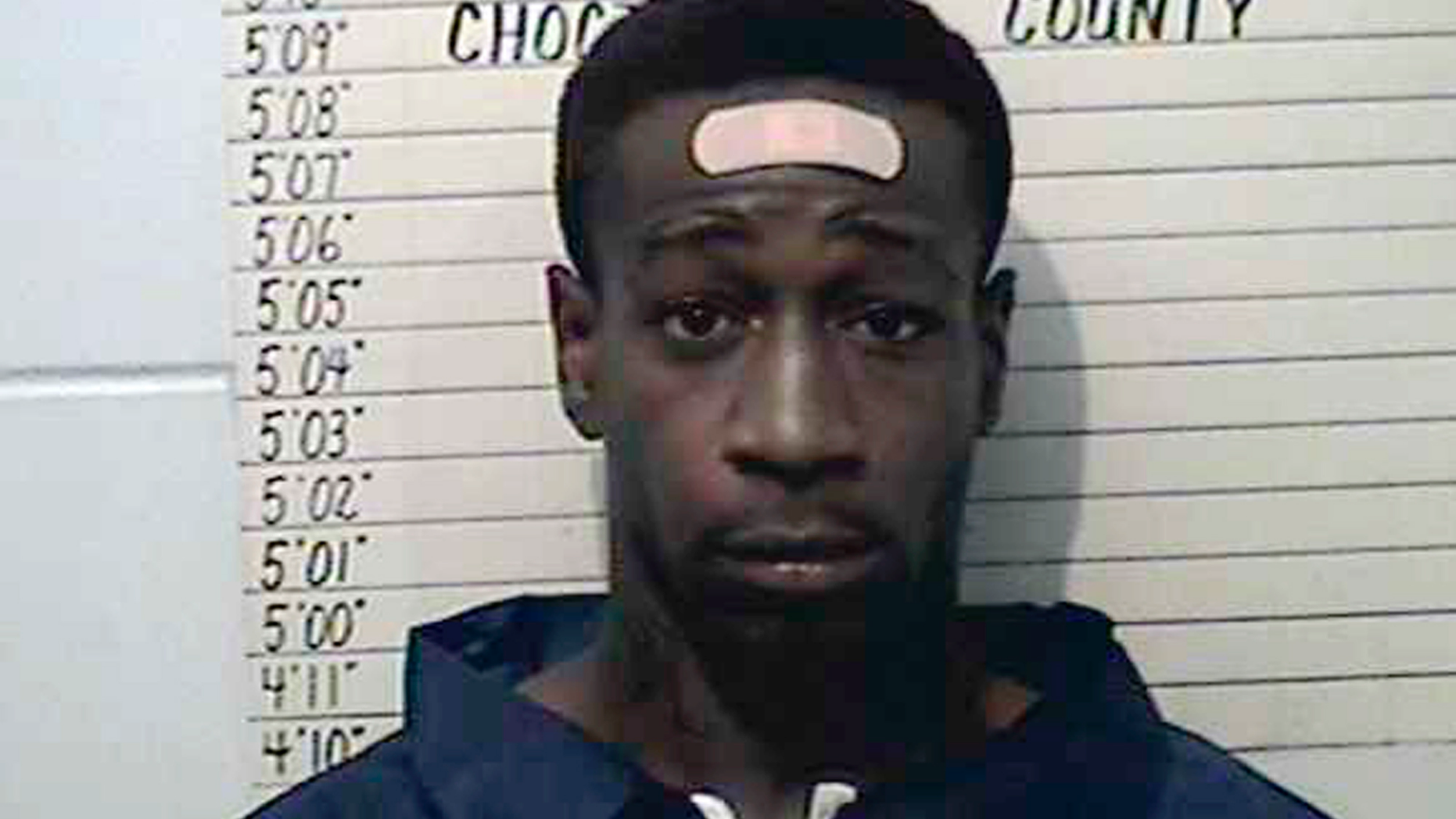 This undated booking photo provided by Choctaw County Sheriff’s Office shows William DeVaughn Smith. The Oklahoma State Bureau of Investigation said Saturday, April 27, 2019, that injuries suffered by three children when Oklahoma police fired at Smith, a robbery suspect in a pickup truck, are non-life threatening. Smith is suspected in an April 11 armed robbery at a Pizza Hut in Hugo, Okla. He hasn't been formally charged. (Choctaw County Sheriff’s Office via AP)