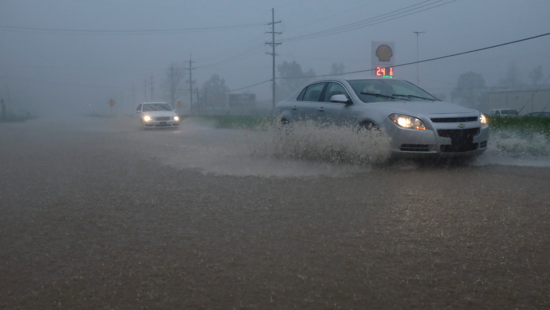 Vehicles travel through a flooded section of Highway 61 South following severe weather on Saturday, April 13, 2019 in Vicksburg, Miss. Authorities say a possible tornado has touched down in western Mississippi, causing damage to several businesses and vehicles. John Moore, a forecaster with the National Weather Service in Jackson, says a twister was reported Saturday in the Vicksburg area of Mississippi and was indicated on radar. (Courtland Wells/The Vicksburg Post via AP)