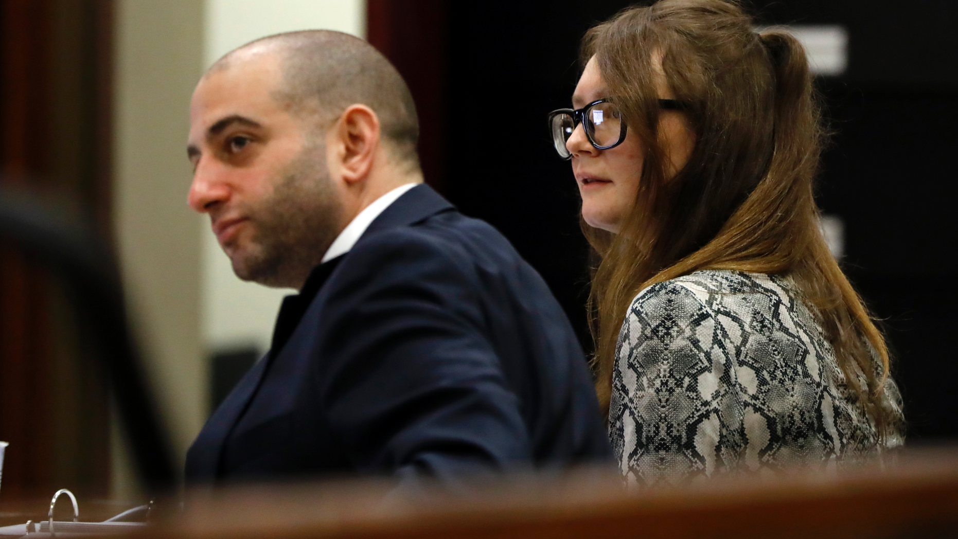 Attorney Todd Spodek and Anna Sorokin sit at the defense table during her trial at New York State Supreme Court, in New York, Monday, April 22, 2019. Sorokin, who claimed to be a German heiress, is on trial on grand larceny and theft of services charges. (AP Photo/Richard Drew)