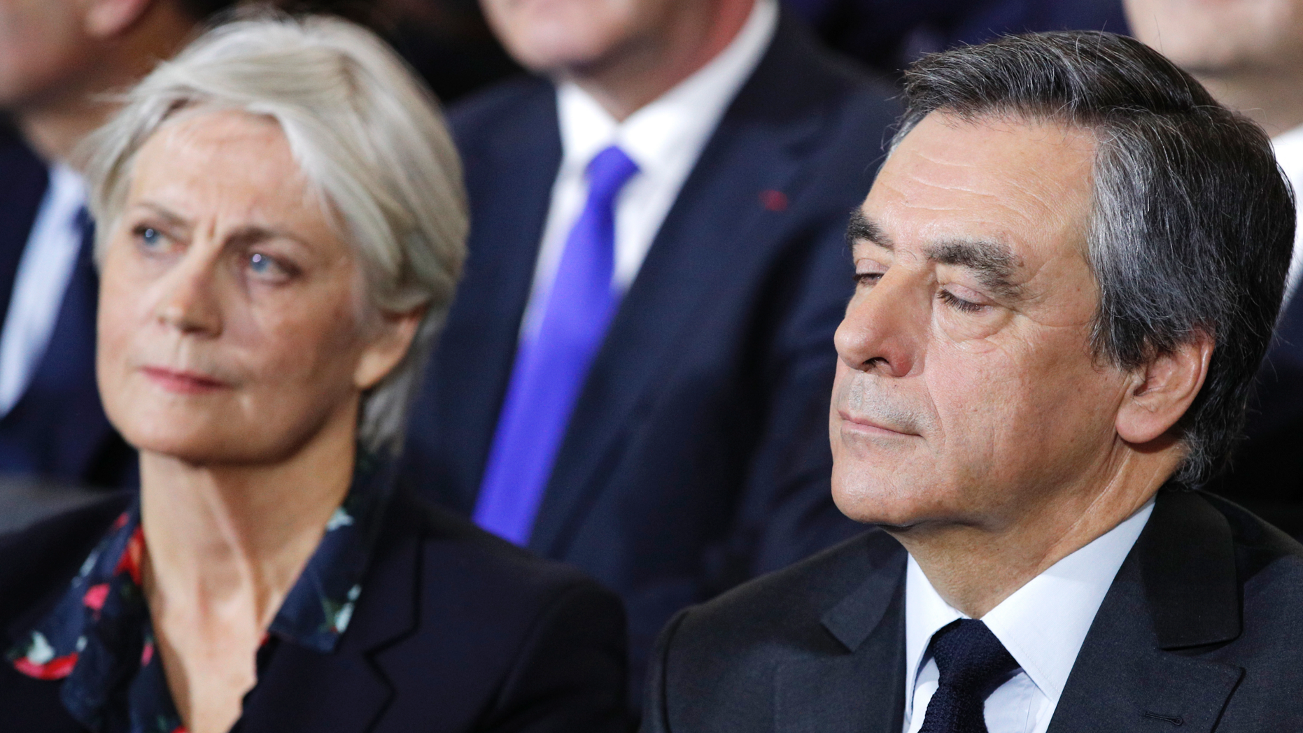 FILE - In this Jan. 29, 2017 file photo, conservative presidential candidate Francois Fillon and his wife Penelope attend a campaign meeting in Paris. A French judicial official says investigating judges have requested that former Prime Minister Francois Fillon and his wife stand trial on corruption charges. (AP Photo/Christophe Ena, File)