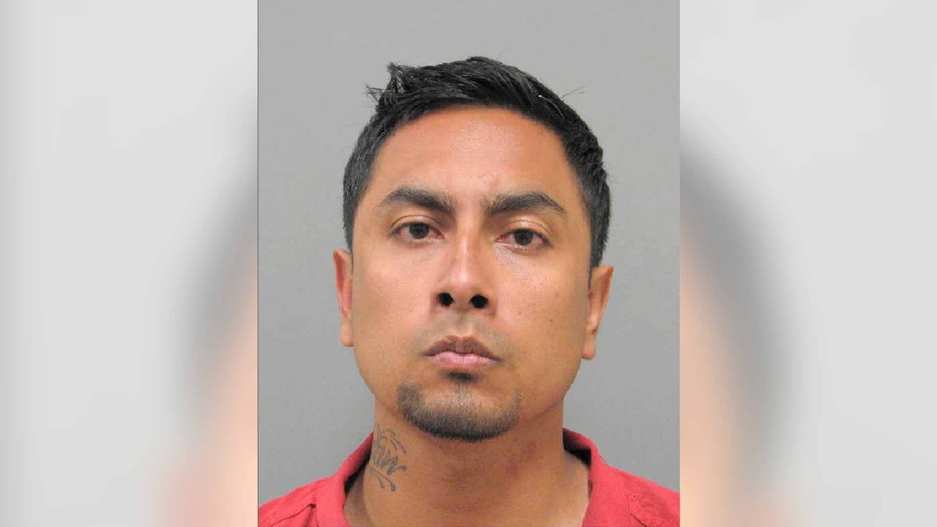 FILE - This undated photo released by the Henderson Detention Center shows Juan Ivan Barajas of San Gabriel, Calif. The Archdiocese of Los Angeles has agreed to pay $8 million to a teenager who was sexually abused by Barajas, the athletic director at her Catholic high school who continued to work despite prior allegations of misconduct, the Los Angeles Times reported Tuesday, April 16, 2019. (Henderson Police Department via AP, File)