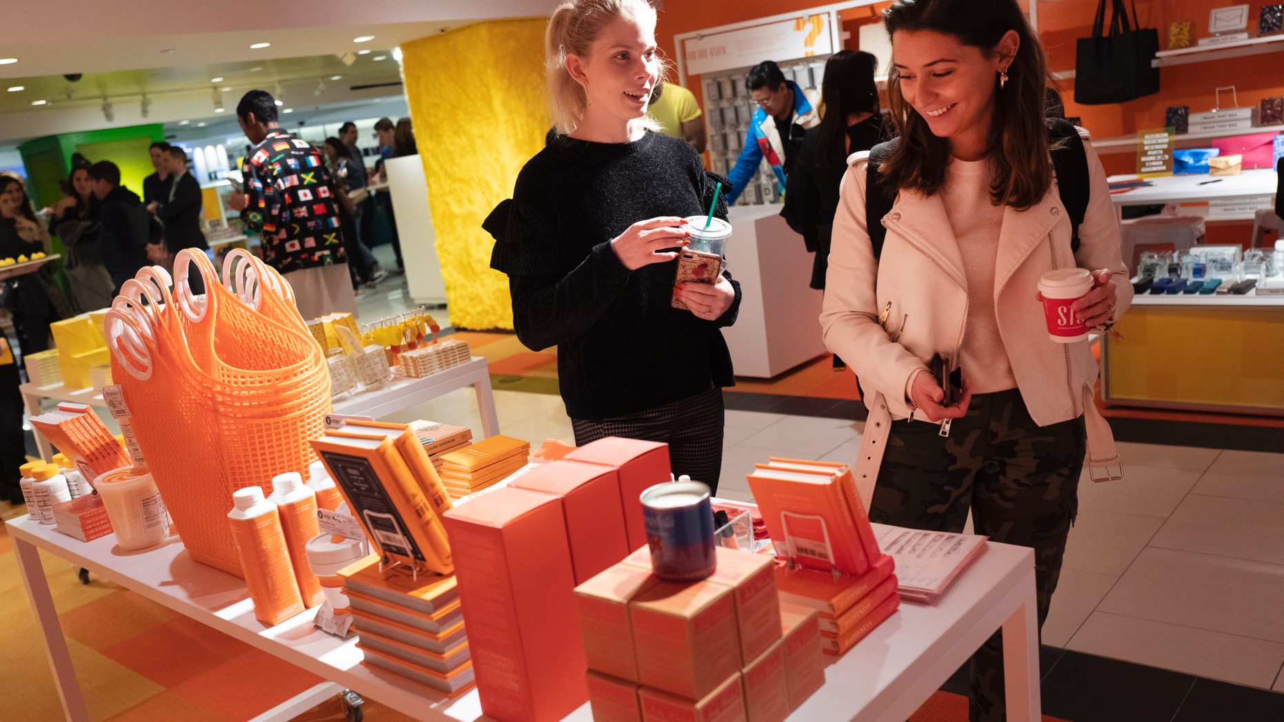 FILE - In this April 10, 2019, file photo visitors to Story walk through the shop now located at Macy's in New York. On Thursday, April 18, the Commerce Department releases U.S. retail sales data for March. (AP Photo/Mark Lennihan, File)