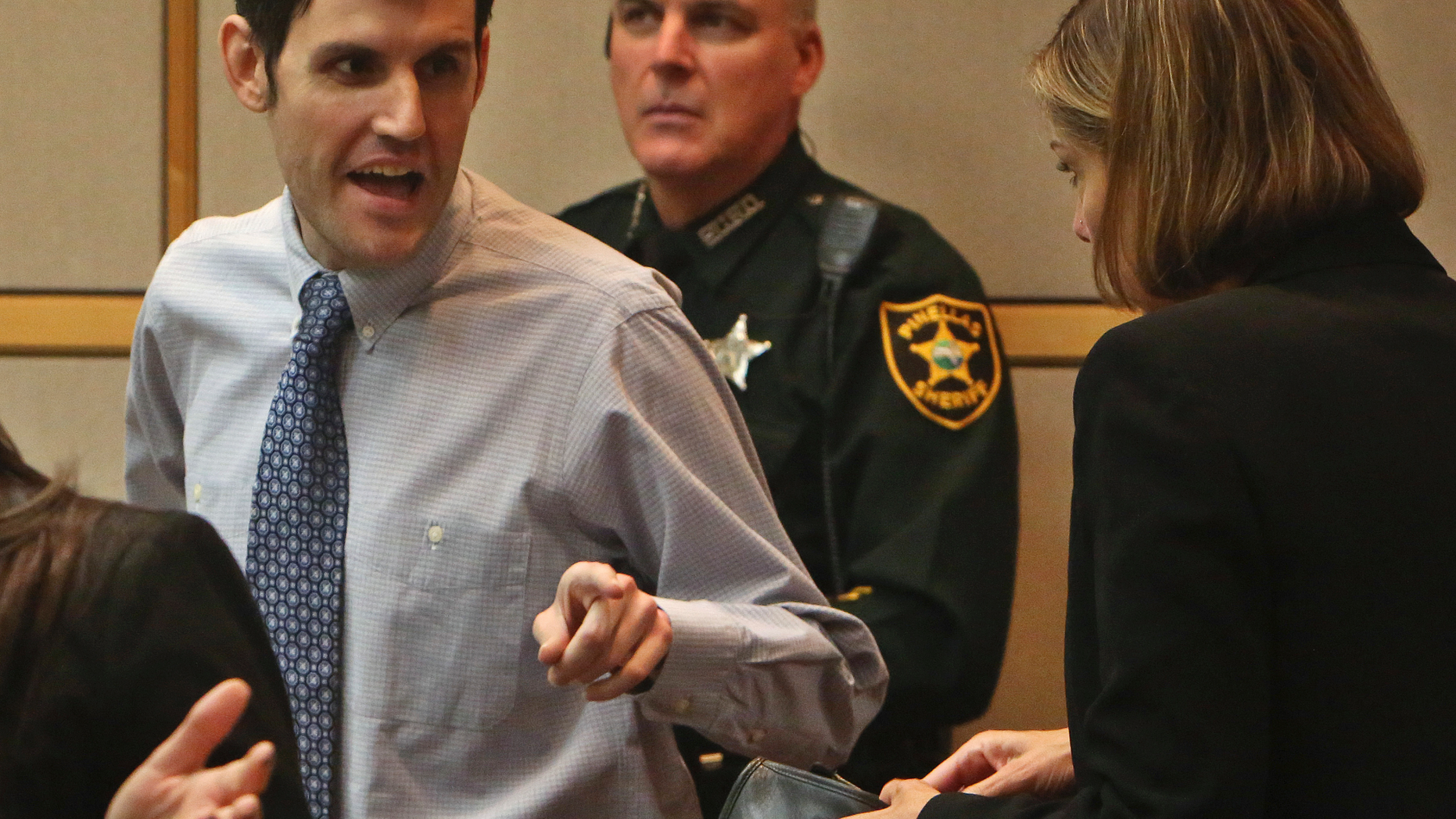 Defendant John Jonchuck, left, talks with his attorney Jane McNeill, right, during a break in his murder trial, Tuesday, April 2, 2019 at the Pinellas County Criminal Justice Center in Clearwater, Fla. Jonchuck is accused of killing his 5-year-old daughter by dropping her off a bridge (Scott Keeler/Tampa Bay Times via AP, Pool)