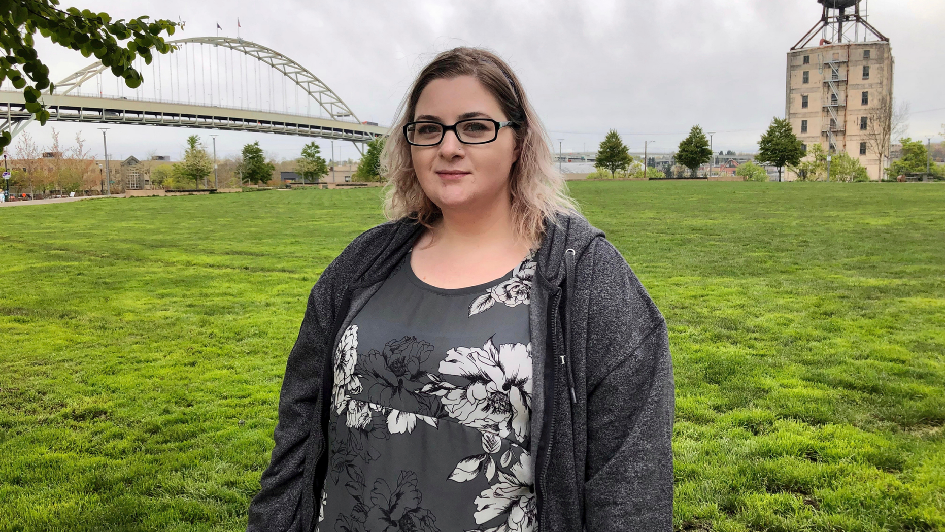 In this Monday, April 15, 2019, photo Elizabeth Graves, a 27-year-old resident of Portland, Ore., who was in foster care for more than five years, poses for a photo in a Portland, Ore., park. Children that are still under the care of Oregon's foster care system filed a lawsuit Tuesday, April 16, alleging the state exposed them to abuse and further neglect. Graves is not a plaintiff, but she says she was shuffled through 15 foster care families between the ages of 13 and 18 and many of the allegations in the lawsuit bring back bad memories for her. (AP Photo/Gillian Flaccus)