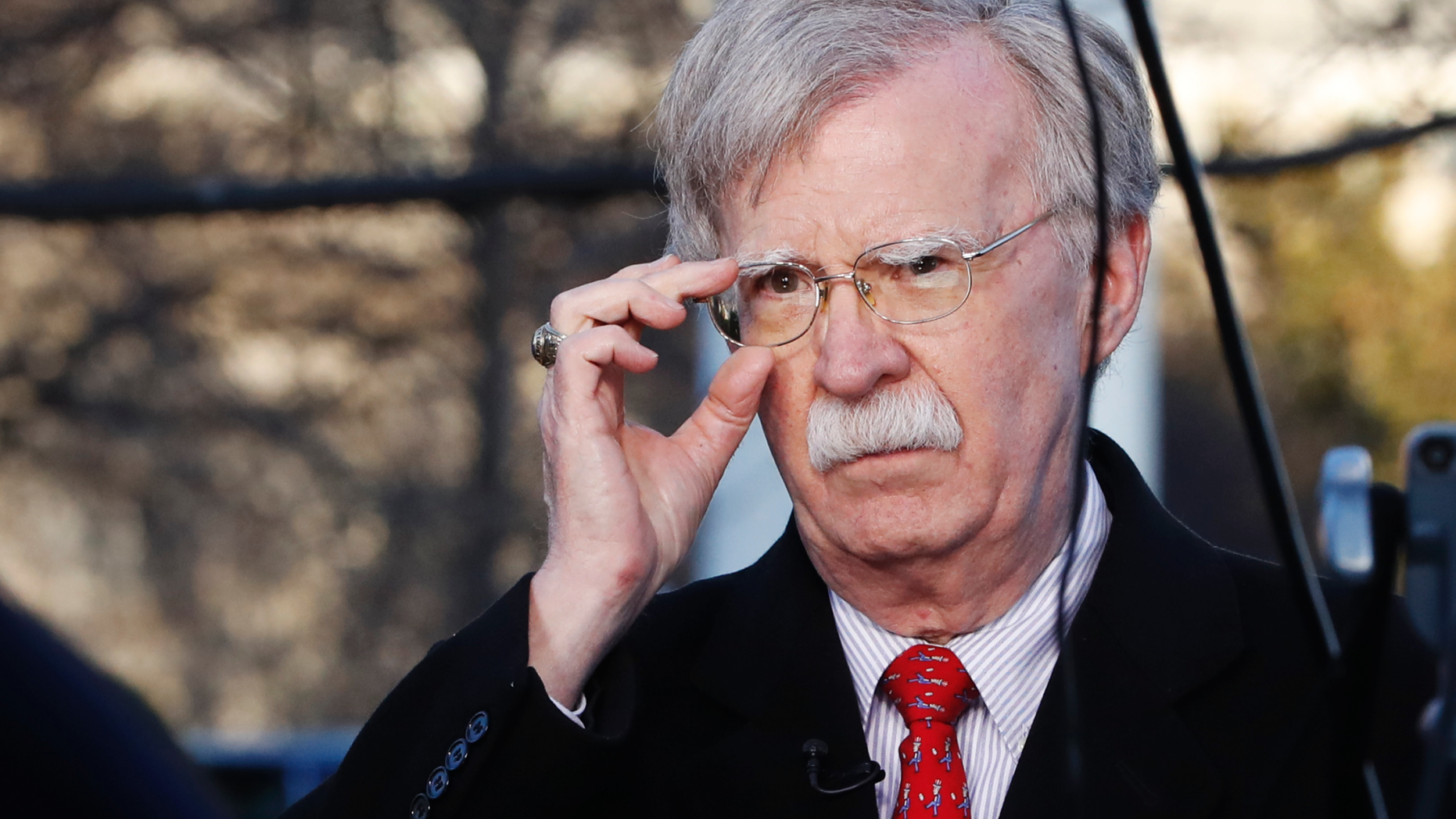 FILE - In this March 5, 2019, file photo, U.S. national security adviser John Bolton adjusts his glasses before an interview at the White House in Washington. North Korea has issued a relatively mild criticism of White House national security adviser John Bolton over a recent interview he gave. State media on Saturday cited First Vice Foreign Minister Choe Son Hui as criticizing Bolton for telling Bloomberg News that the U.S. would need more evidence of North Korea’s disarmament commitment before a third leaders’ summit. (AP Photo/Jacquelyn Martin, File)