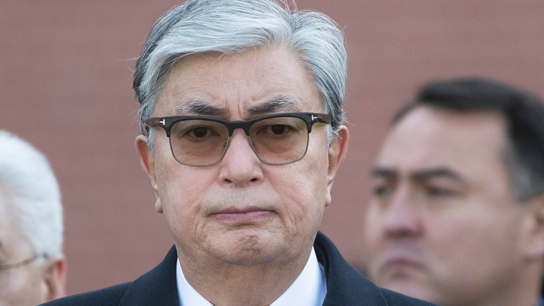 Kazakhstan's interim President Kassym-Jomart Tokayev, center, attends a wreath laying ceremony at the Tomb of the Unknown Soldier by the Kremlin wall in Moscow, Russia, Thursday, April 4, 2019. (AP Photo/Pavel Golovkin, Pool)