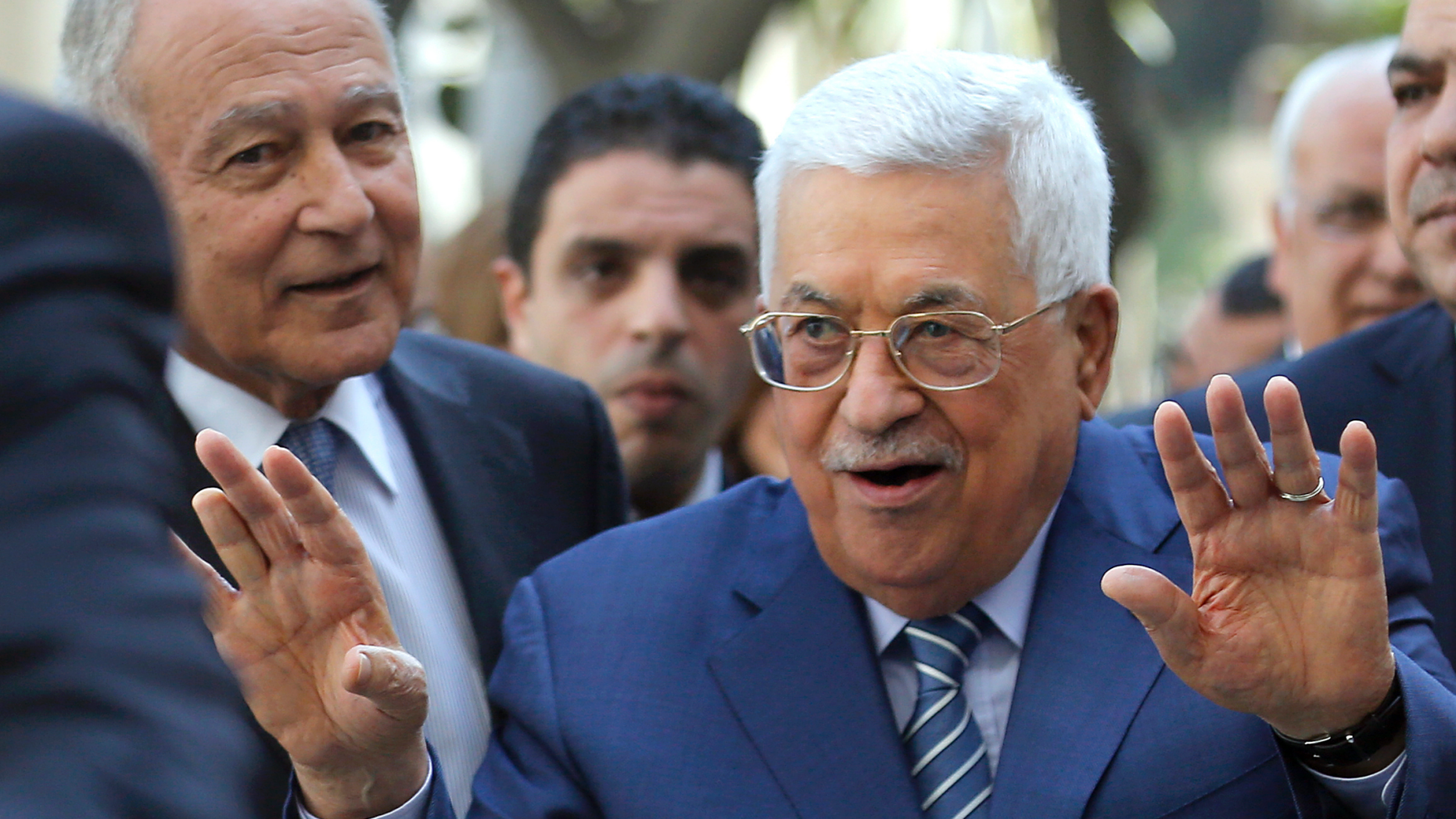 Palestinian President Mahmoud Abbas, left, speaks as he is accompanied by Arab League Secretary-General, Ahmed Aboul Gheit, at the Arab League headquarters in Cairo, Egypt, Sunday, April 21, 2019. Abbas attends the extraordinary session of the Arab League foreign ministers to discuss the situation in the Palestinian territories. (AP Photo/Amr Nabil)