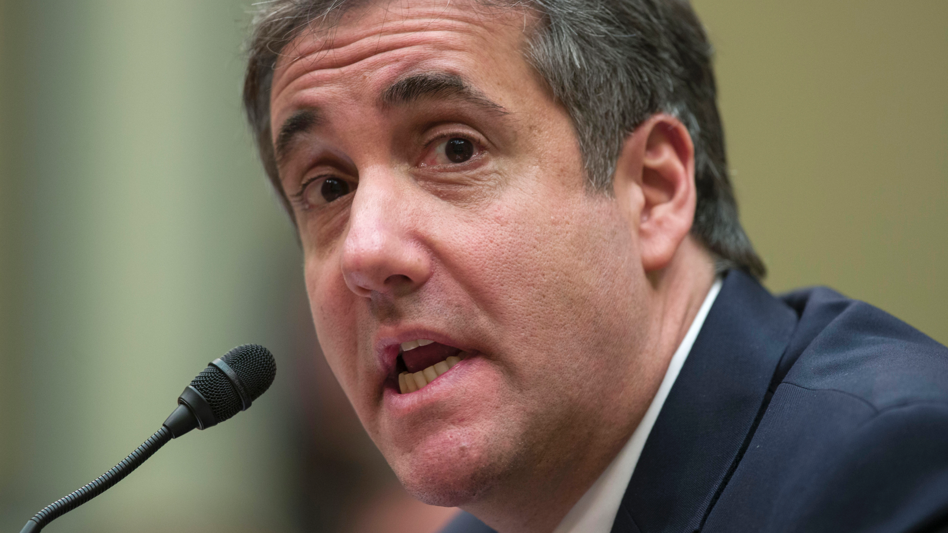 FILE - In this Feb. 27, 2019, file photo, Michael Cohen, President Donald Trump's former lawyer, testifies before the House Oversight and Reform Committee, on Capitol Hill in Washington. Mueller found some evidence in the redacted report released Thursday, April 18, that suggests Trump may have intended to discourage Cohen from cooperation. But he reached no conclusion on whether Trump obstructed justice. (AP Photo/Alex Brandon, File)