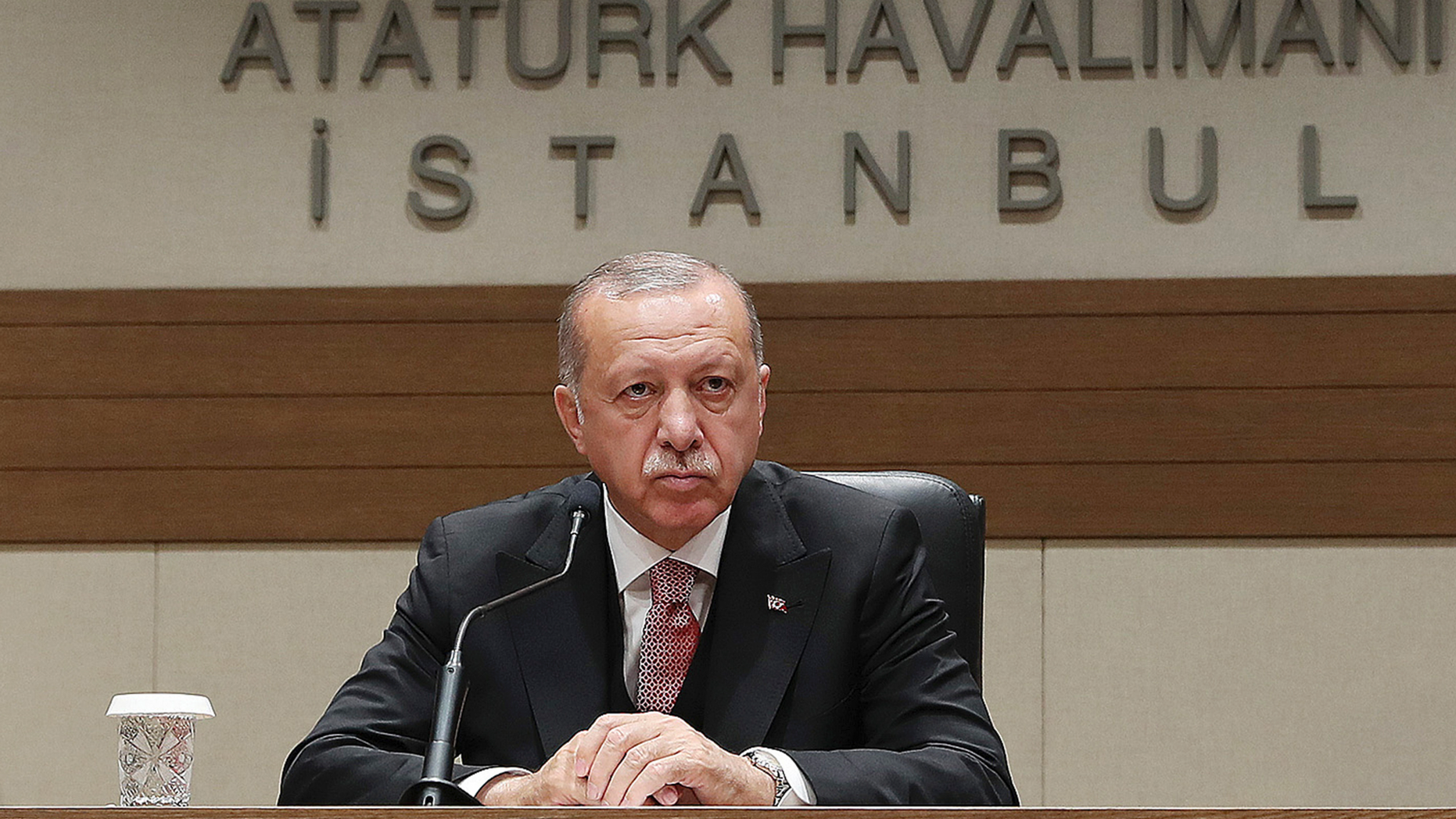 Turkey's President Recep Tayyip Erdogan talks to members of the media regarding the local elections, in Istanbul, Monday, April 8, 2019, prior to his departure for Russia. Erdogan has defended his ruling party's move to demand a full recount of votes cast in mayoral elections in Istanbul, claiming that "almost all" of the voting was marred by irregularities. Erdogan suffered a major setback in last week's local elections after the opposition took control of the capital Ankara and won a tight race for Istanbul. (Presidential Press Service via AP, Pool)