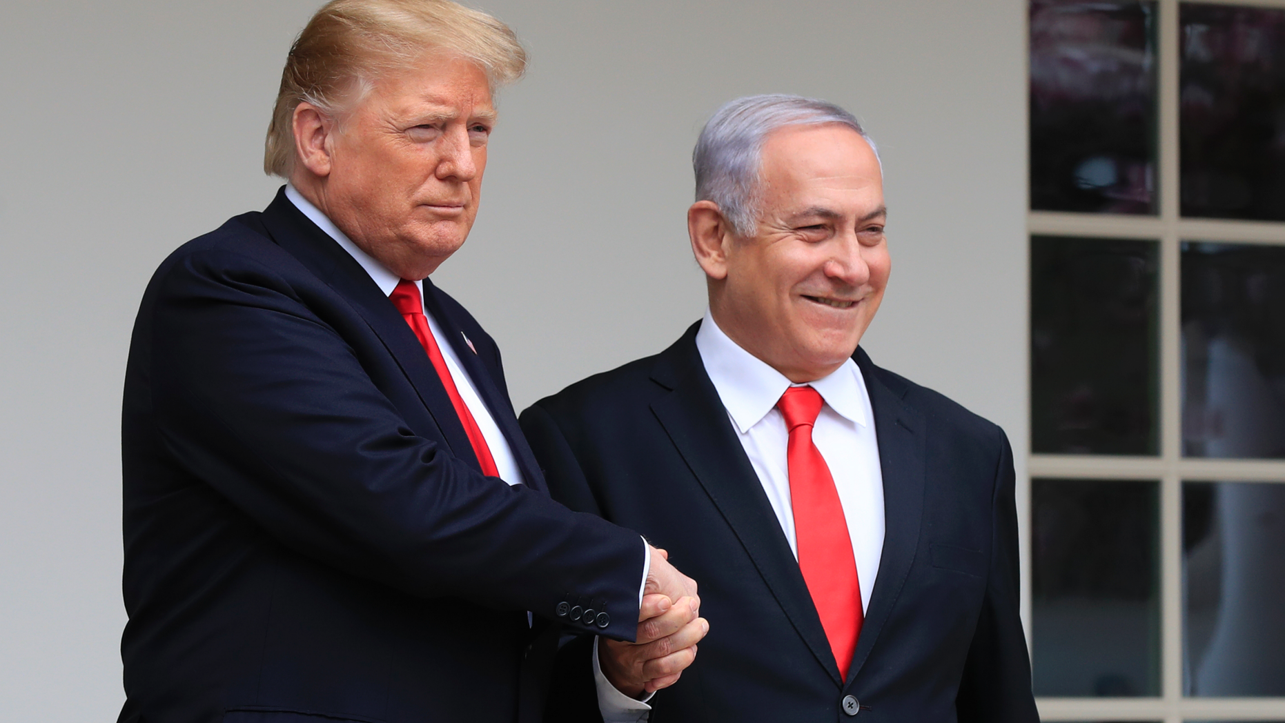 FILE - In this Monday, March 25, 2019 file photo, President Donald Trump welcomes visiting Israeli Prime Minister Benjamin Netanyahu to the White House in Washington. In a tight race for re-election, Israel’s prime minister has gotten a welcome lift from his friend in the White House. In the run-up to the April 9 vote, Netanyahu has hosted Secretary of State Mike Pompeo, visited Trump in the White House and received American recognition of Israeli sovereignty over the Golan Heights, which Israel seized from Syria during the 1967 Mideast war. (AP Photo/Manuel Balce Ceneta, File)