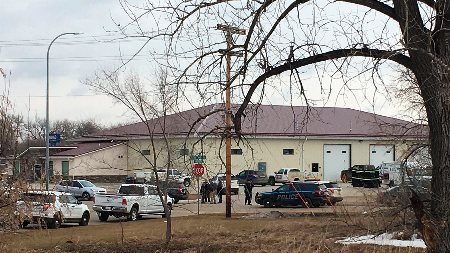 Police vehicles are seen at the back of RJR Maintenance and Management, a property management company, on Monday, April 1, 2019, Mandan, ND. Authorities say the police responded to a medical appeal regarding the police. North Dakota activity. 