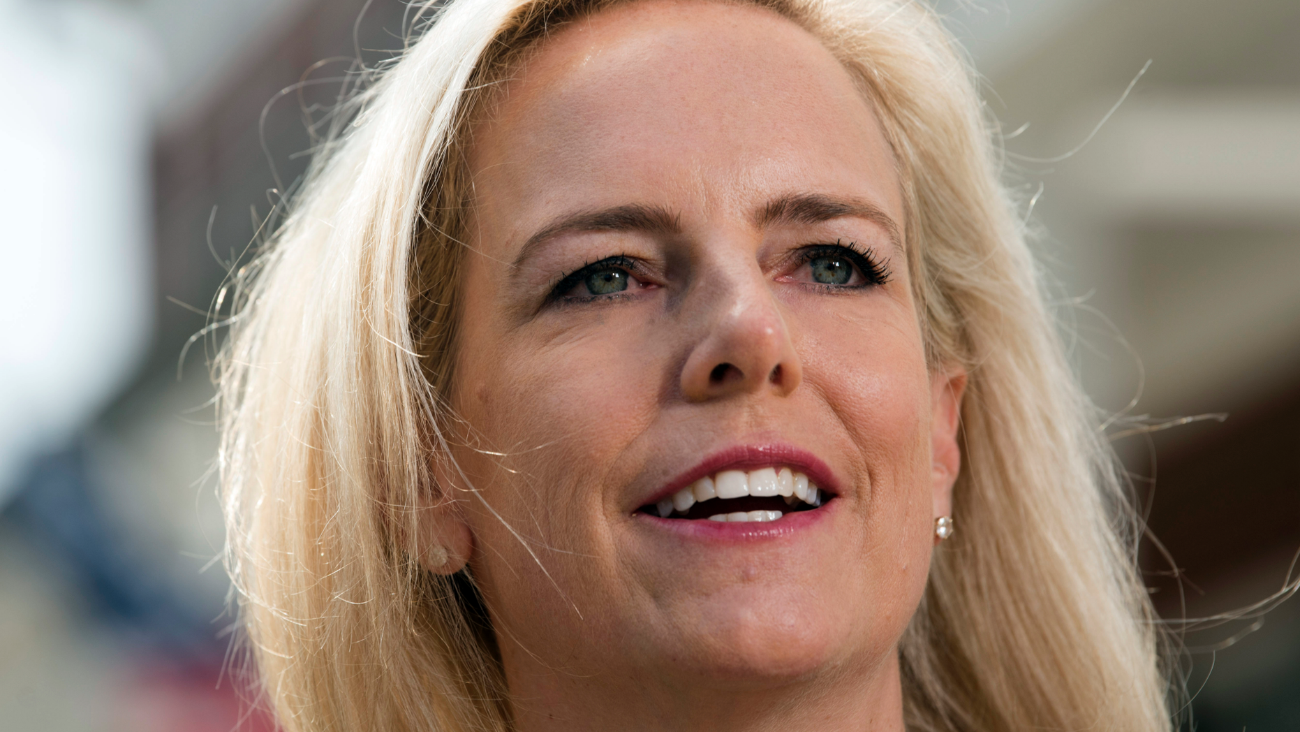 Homeland Security Secretary Kirstjen Nielsen talks outside her home in Alexandria, Va., on Thursday, April 8, 2019. Nielsen says she continues to support the president’s goal of securing the border in her first public remarks since her surprise resignation. (AP Photo/Kevin Wolf)