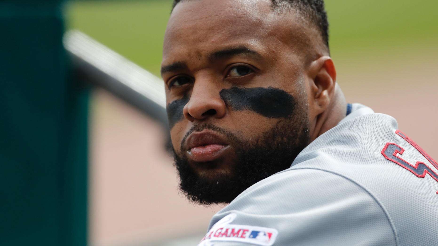 FILE - In this a Wednesday, April 10, 2019, Cleveland Indians' Carlos Santana watches from the dugout during the sixth inning of a baseball game against the Detroit Tigers in Detroit. The Indians first baseman was sworn in as a U.S. citizen on Friday, April 19, 2019, taking the "Oath of Citizenship" with 83 others while his two young daughters fought for his attention. (AP Photo/Carlos Osorio, File)