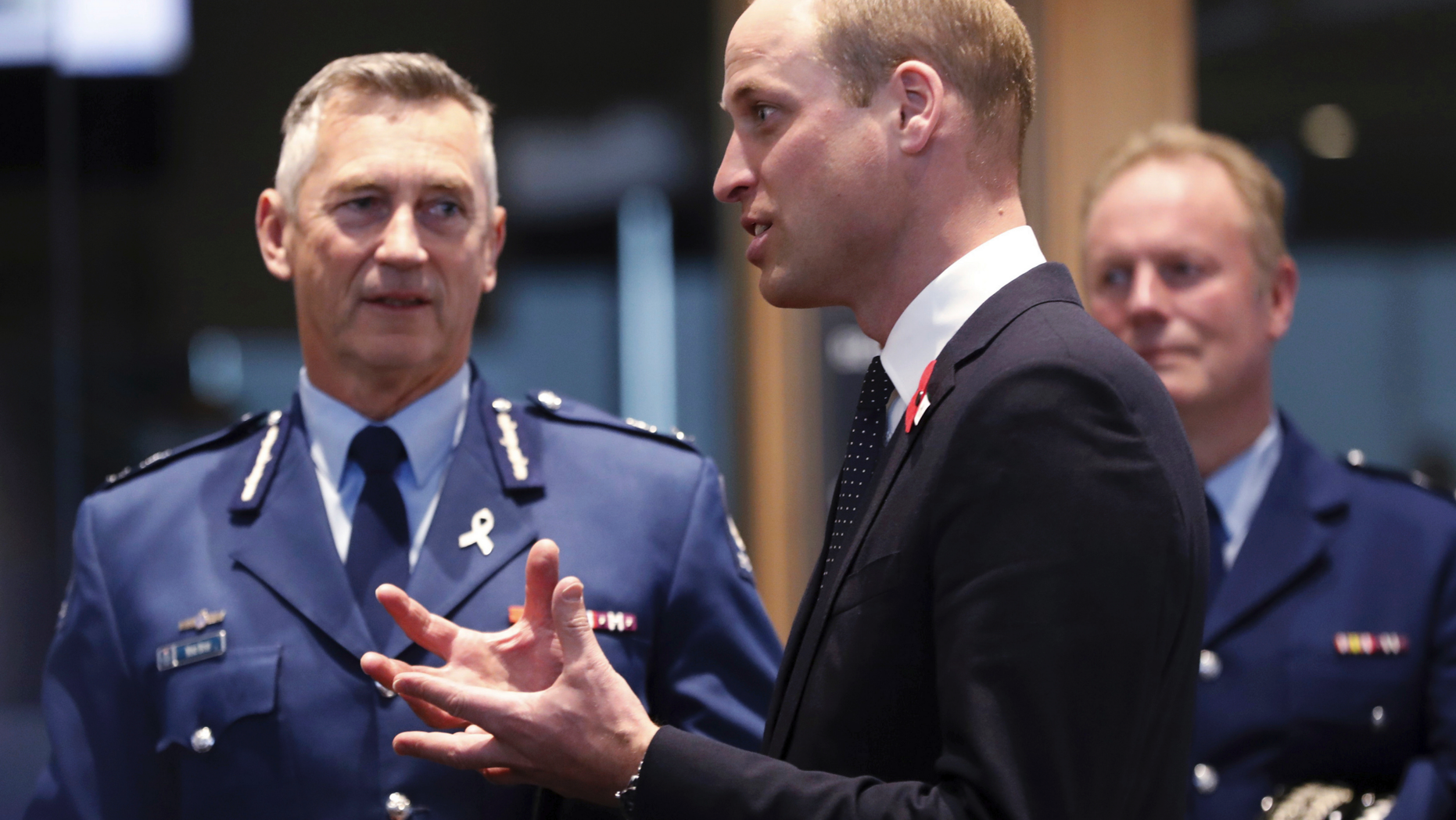 Britain's Prince William, center, meets with Police St. Johns ambulance staff during a visit to the Justice and Emergency Services Precinct in Christchurch, New Zealand, Thursday, April 25, 2019. Prince William is on a two-day visit to New Zealand to take part in ANZAC ceremonies and visit the two mosques where a gunman killed 50 people on March 15. (Rosa Woods/Pool Photo via AP)