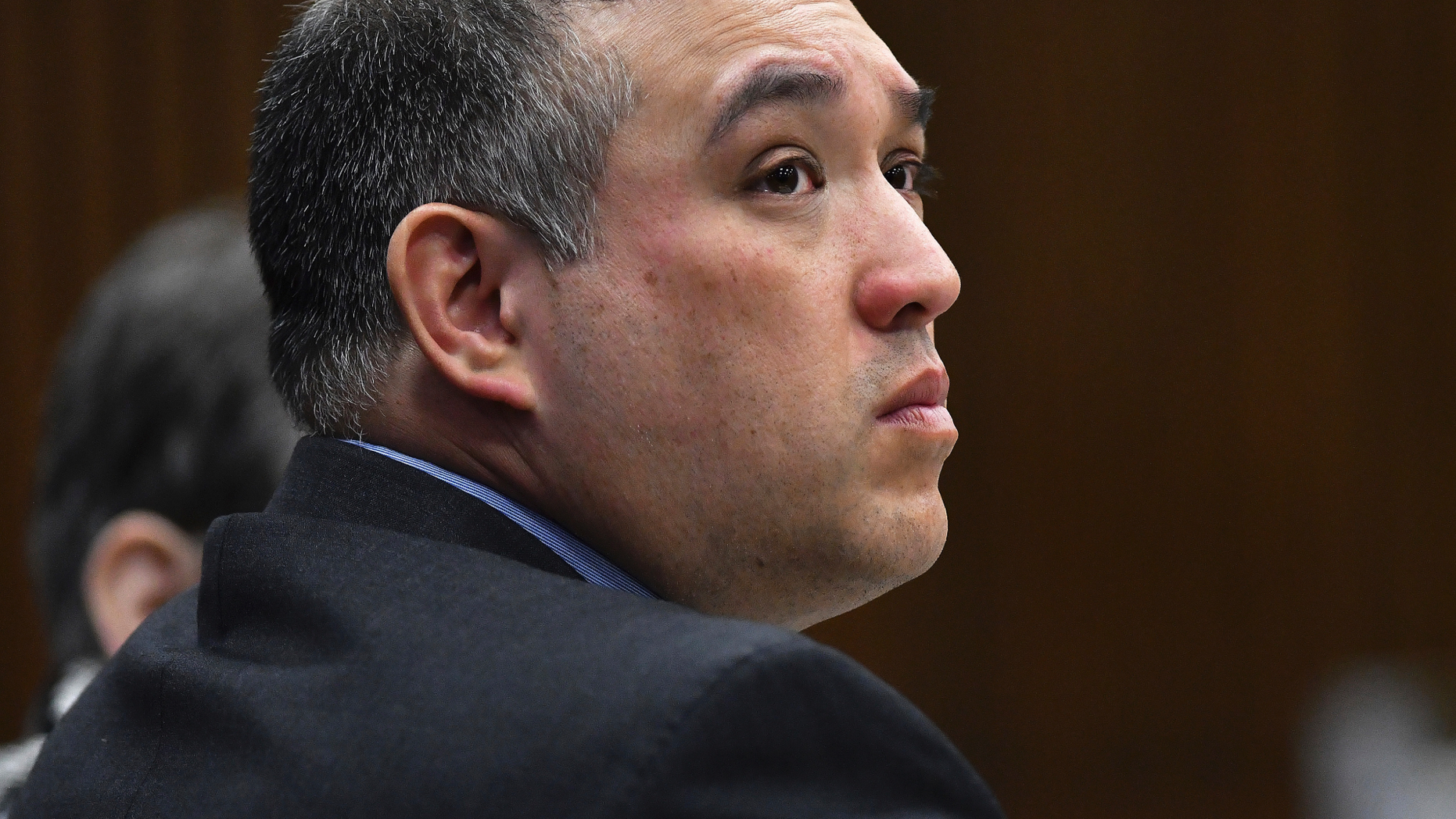 Former Michigan state trooper Mark Bessner listens to Assistant Wayne County Prosecutor Matthew Penney delivers his opening argument in Bessner's trial, Wednesday, April 10, 2019, Detroit. Bessner is charged with second-degree murder in the death of 15-year-old Damon Grimes in 2017. It's the second trial after a jury last fall couldn't reach a unanimous verdict. (Clarence Tabb Jr./Detroit News via AP)