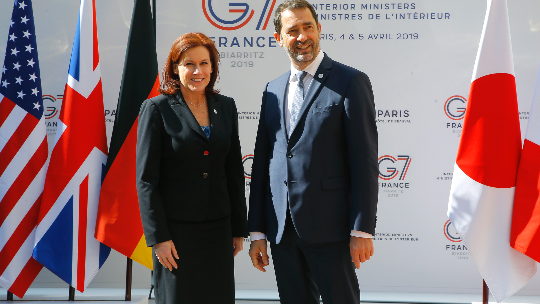 U.S. Homeland Security official Claire Grady, left, is welcomed by French Interior Minister Christophe Castaner for a G7 meeting at ministerial level in Paris, Thursday April 4, 2019. Foreign and interior ministers from the Group of Seven are gathering in France this week to try to find ambitious solutions to world security challenges. Putting a dampener on that are two glaring American absences: U.S. Secretary of State Mike Pompeo and Homeland Security Secretary Kirstjen Nielsen. (AP Photo/Michel Euler)