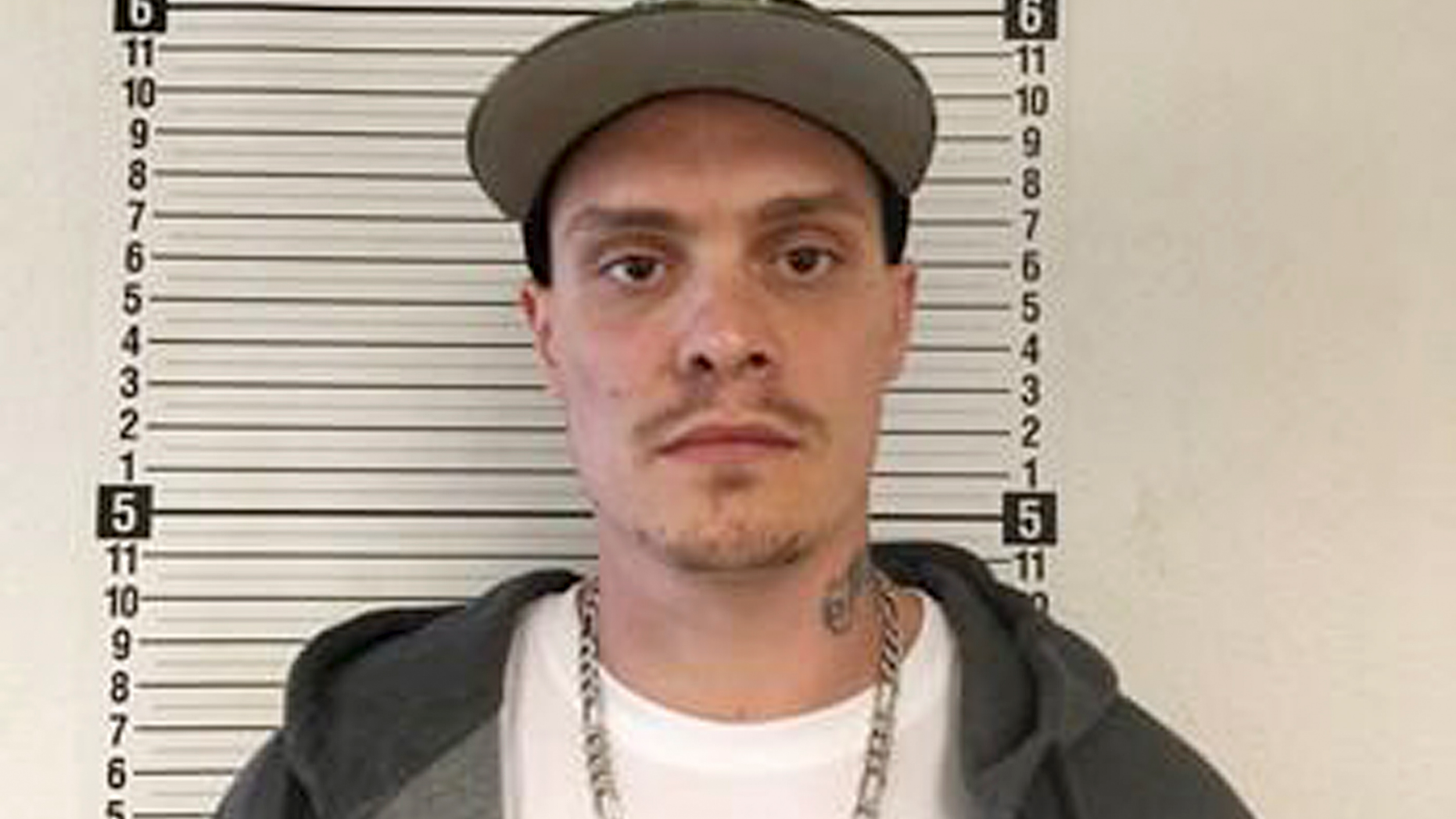 This Oct. 11, 2017, photograph released by the Washington Department of Corrections shows Brian Butts upon his completion of a five-year prison sentence for drug-related crimes. Authorities say Butts shot and killed Cowlitz County Deputy Justin DeRosier in southwestern Washington state on Saturday, April 13, 2019, before being killed by police during a manhunt the following day. (Washington Department of Corrections via AP)