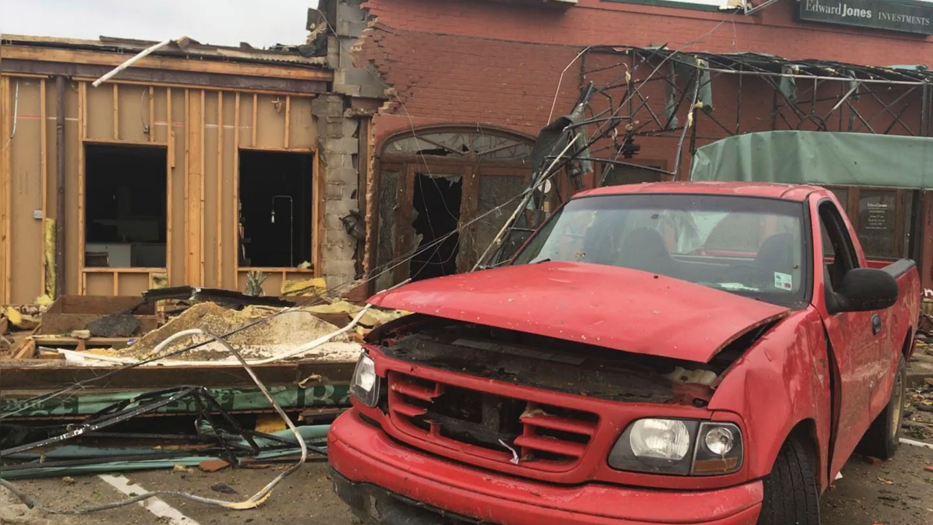 A damaged pickup truck sits in the parking lot of a strip mall that was destroyed by a deadly tornado that tore through the northern Louisiana city of Ruston early Thursday, April 25, 2019. (Jonathan Elmer/The Tech Talk via AP)