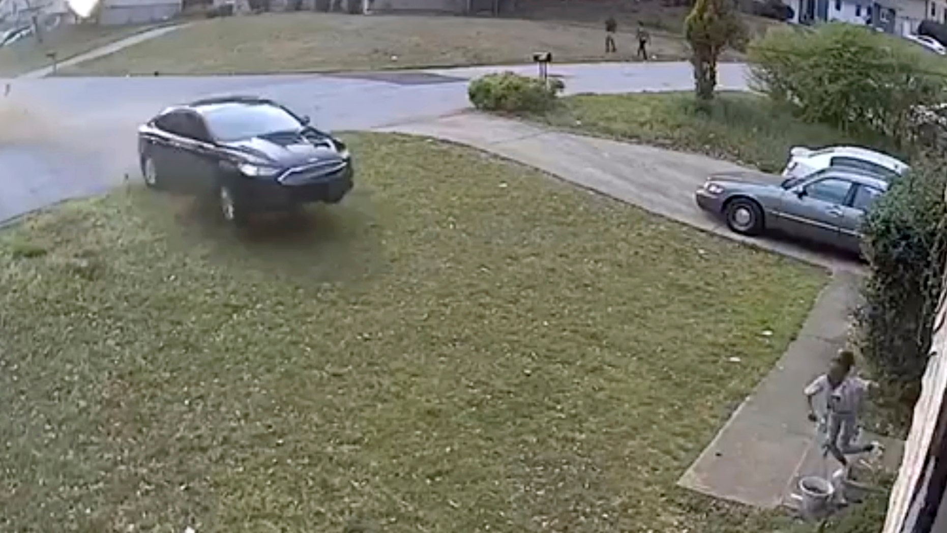 In this video frame grab made available by attorney Chris Stewart, shows a speeding car out of control before it hits LaDerihanna Holmes, 9, as she plays in her front yard Friday, March 29, 2019 in Lithonia, Ga. The driver is still at large. (Chris Stewart via AP)