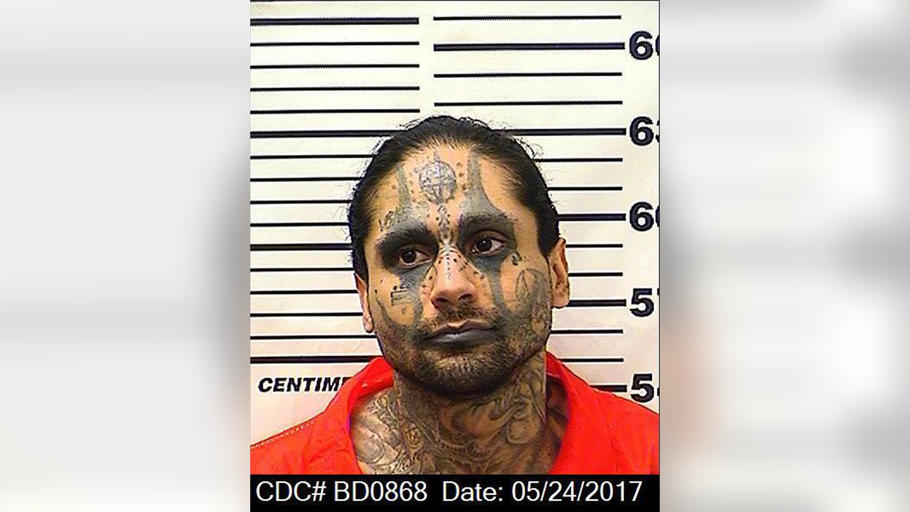 This May 24, 2017, photo released by the California Department of Corrections and Rehabilitation shows Jaime Osuna. Osuna, a convicted killer has been accused of beheading Luis Romero, another in what authorities call a sadistic torture slaying at a California state prison. The Kings County district attorney charged 31-year-old Jaime Osuna with murder in last month's death of Romero, his Corcoran State Prison cellmate. A prosecutor said Friday, April 26, 2019, that Osuna removed an eye, a finger, and a portion of the victim's lung. (California Department of Corrections and Rehabilitation via AP)